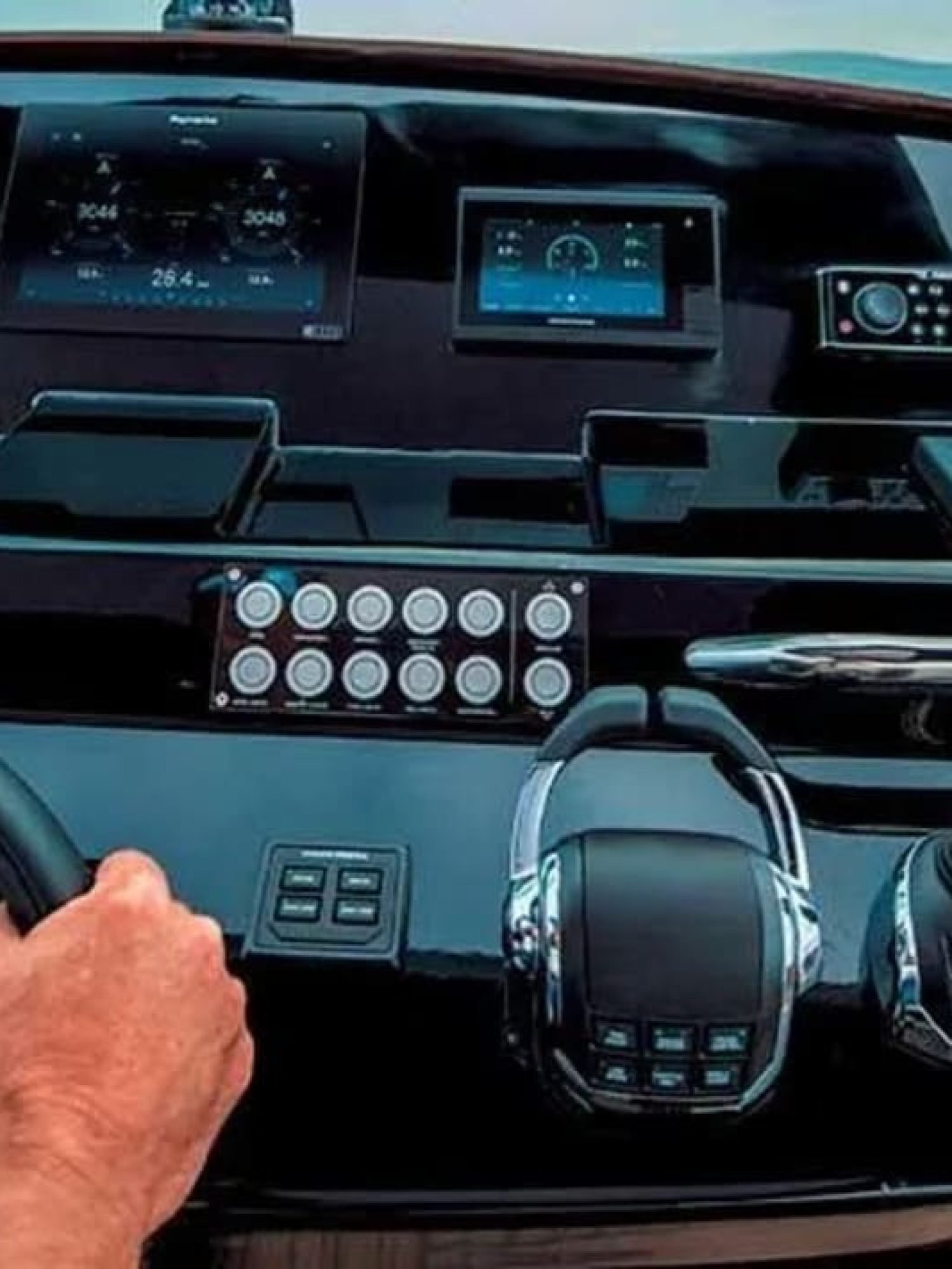 High-tech control panel and steering wheel of the yacht, designed for seamless navigation.