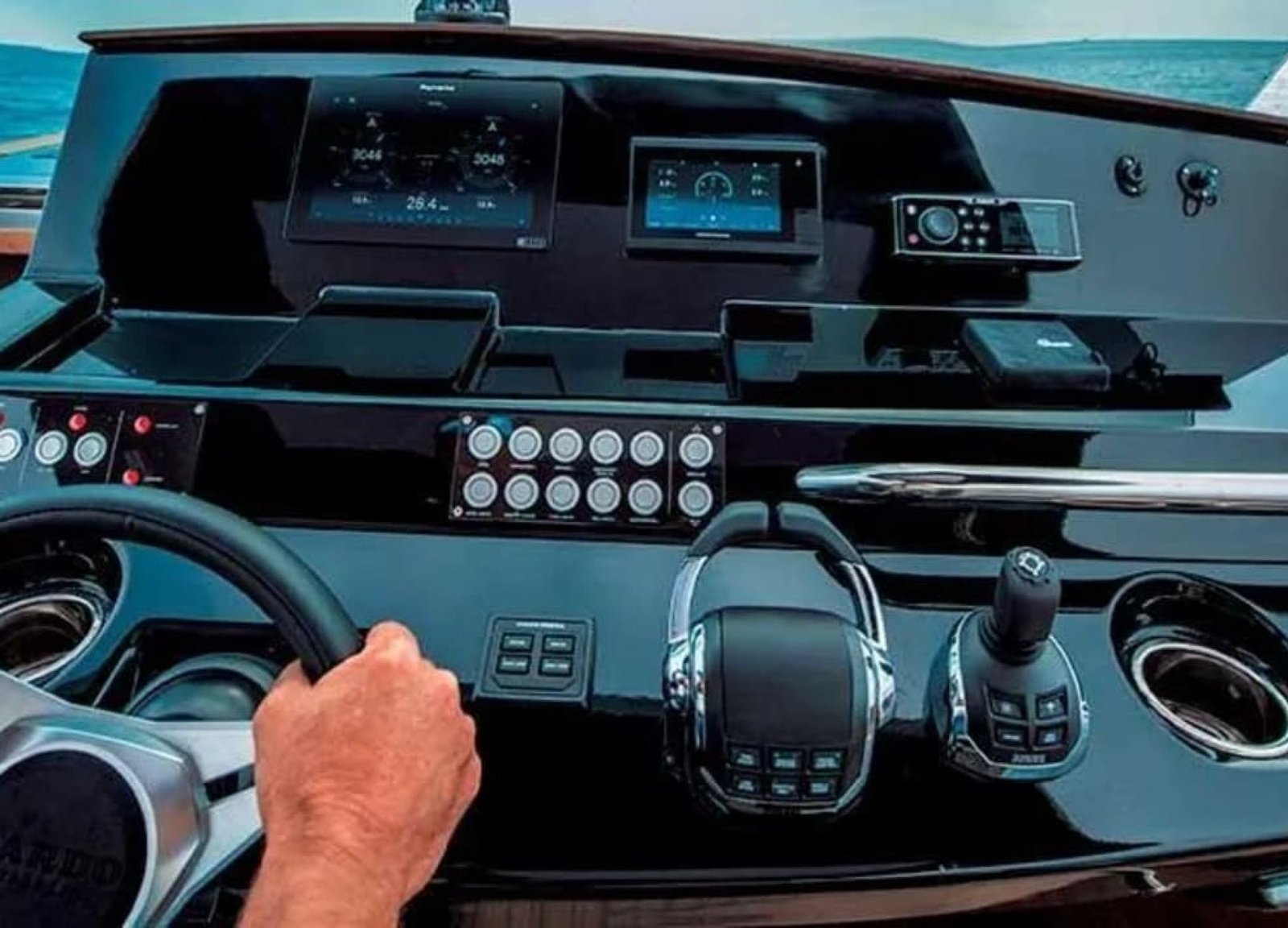 High-tech control panel and steering wheel of the yacht, designed for seamless navigation.