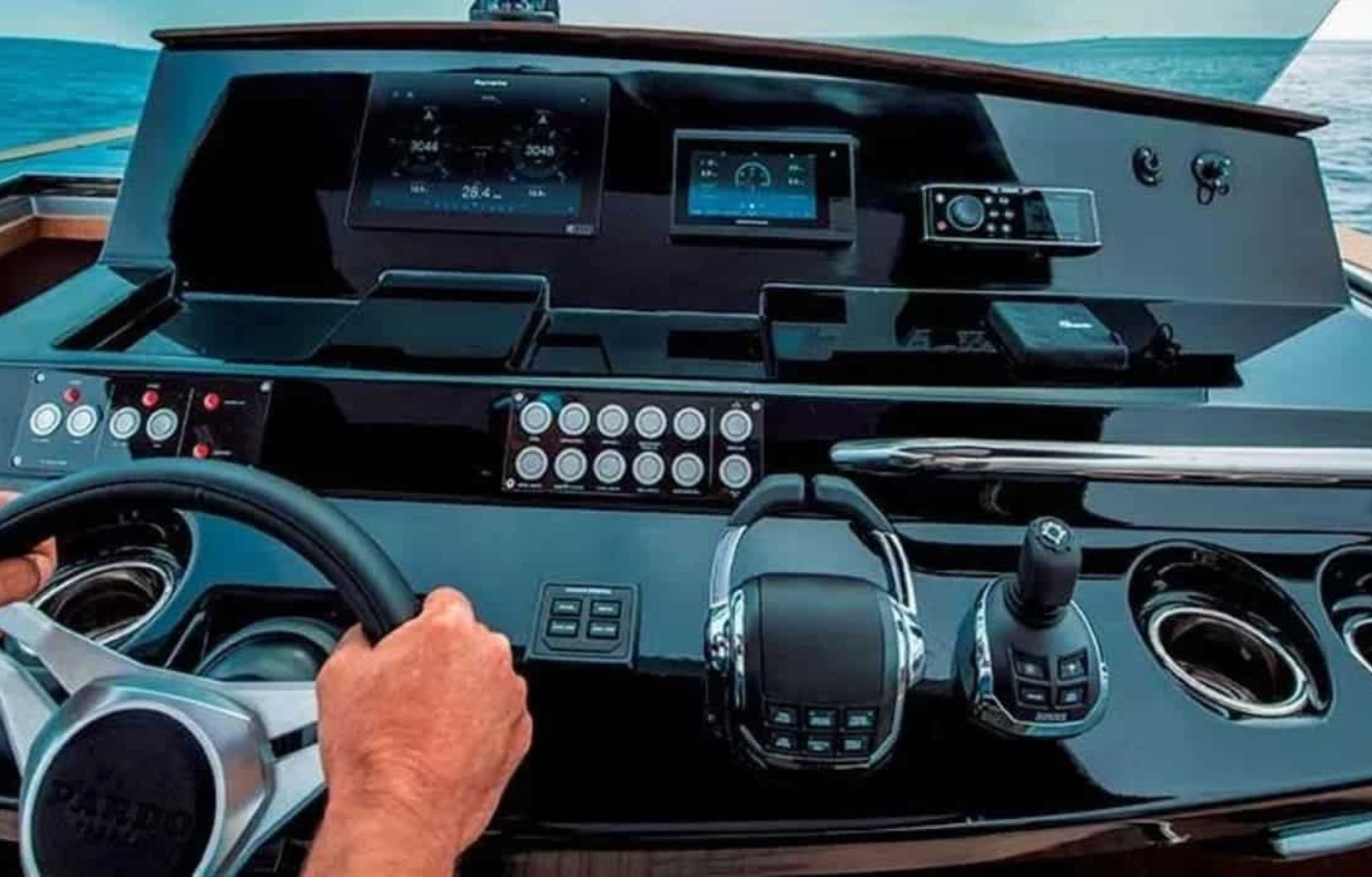 High-tech control panel and steering wheel of the yacht, designed for seamless navigation.