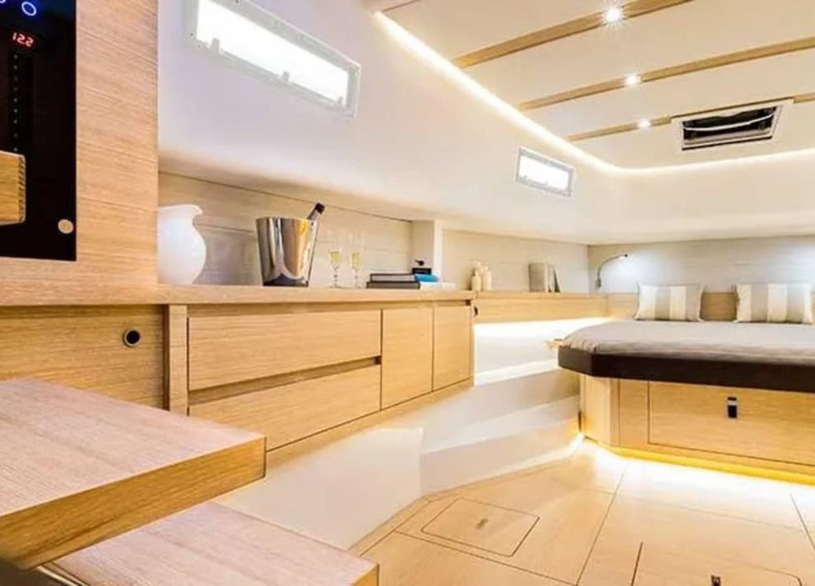 Luxurious bed aboard 43' Pardo yacht, featuring soft bedding for a relaxing sleep