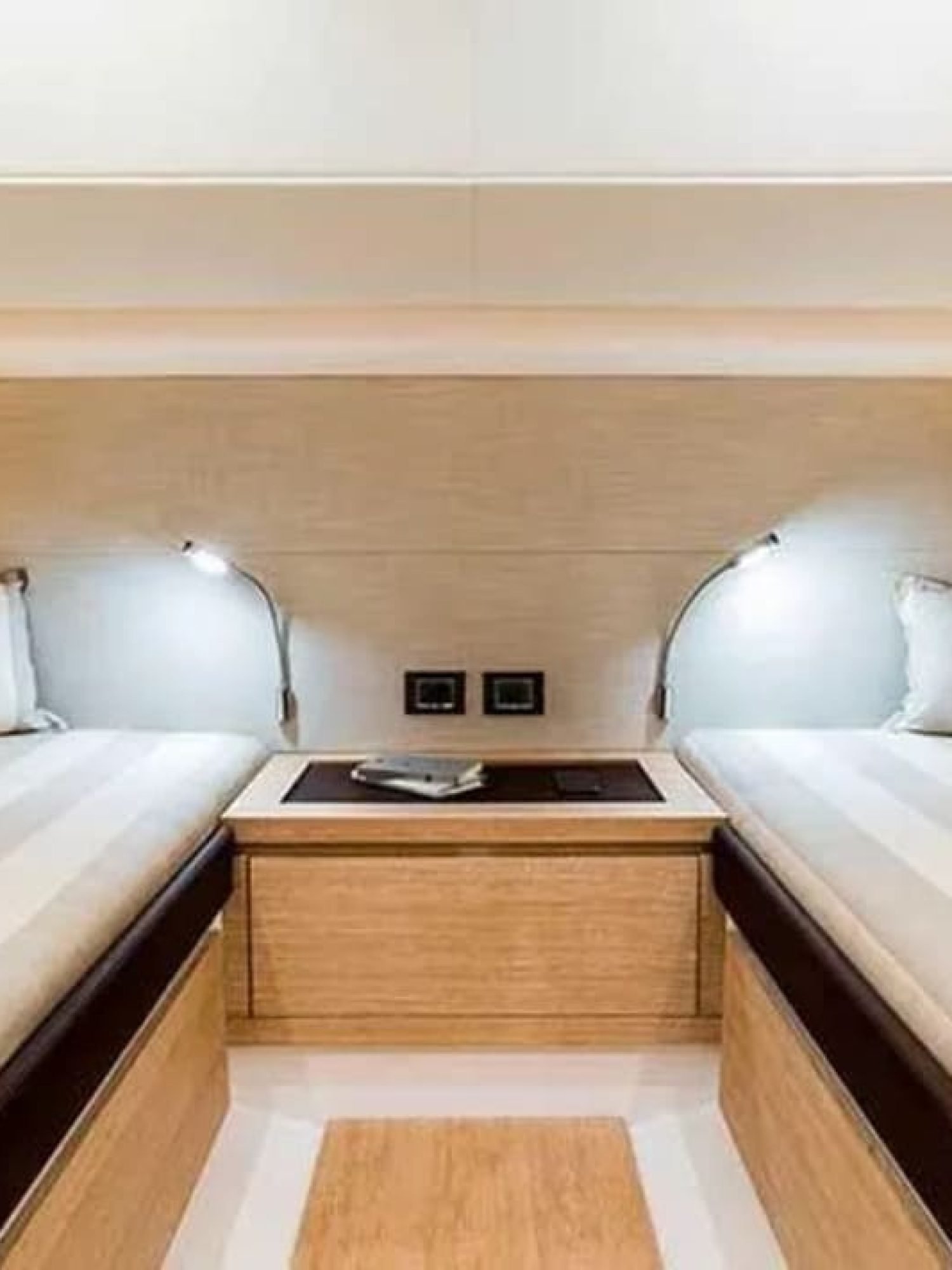 Double bed in a stateroom aboard the 43' Pardo yacht, offering comfort and style