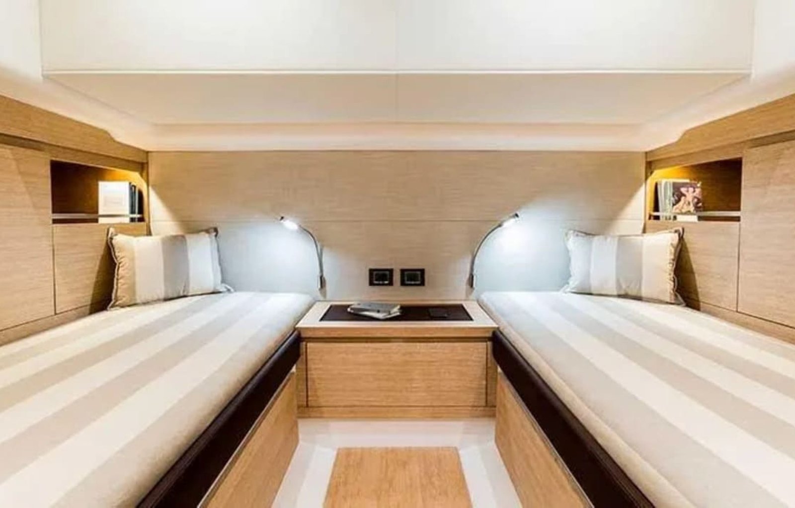 Double bed in a stateroom aboard the 43' Pardo yacht, offering comfort and style