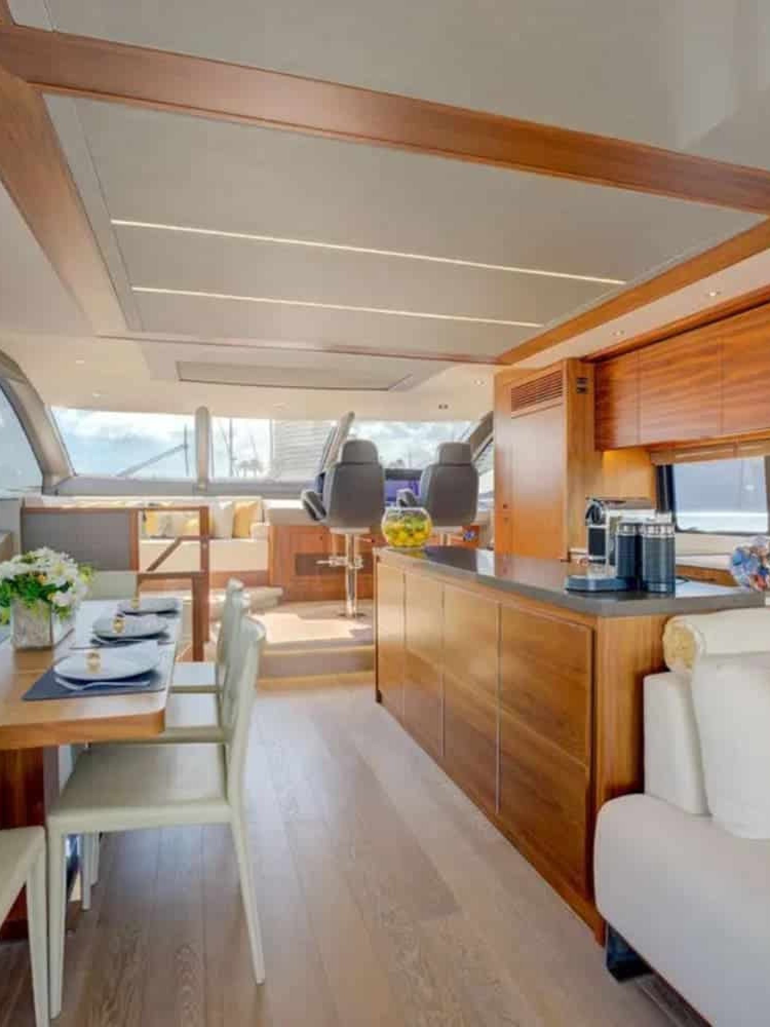 Elegant indoor dining area with stunning ocean views aboard the 78' Sunseeker.