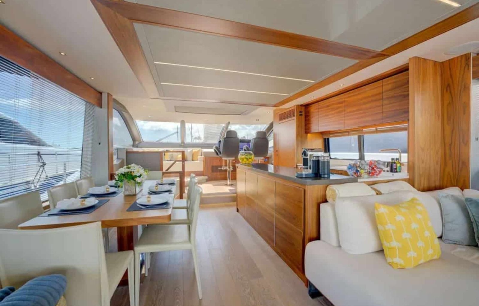 Elegant indoor dining area with stunning ocean views aboard the 78' Sunseeker.