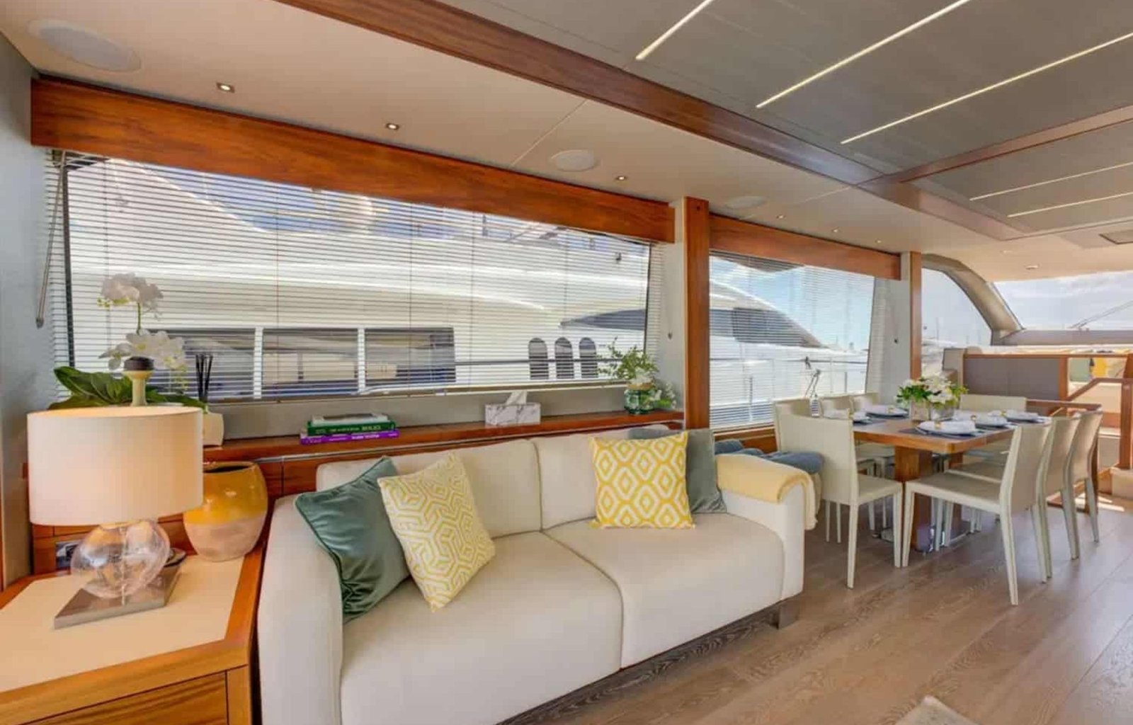 Spacious salon with panoramic windows and luxurious furnishings aboard the 78' Sunseeker.
