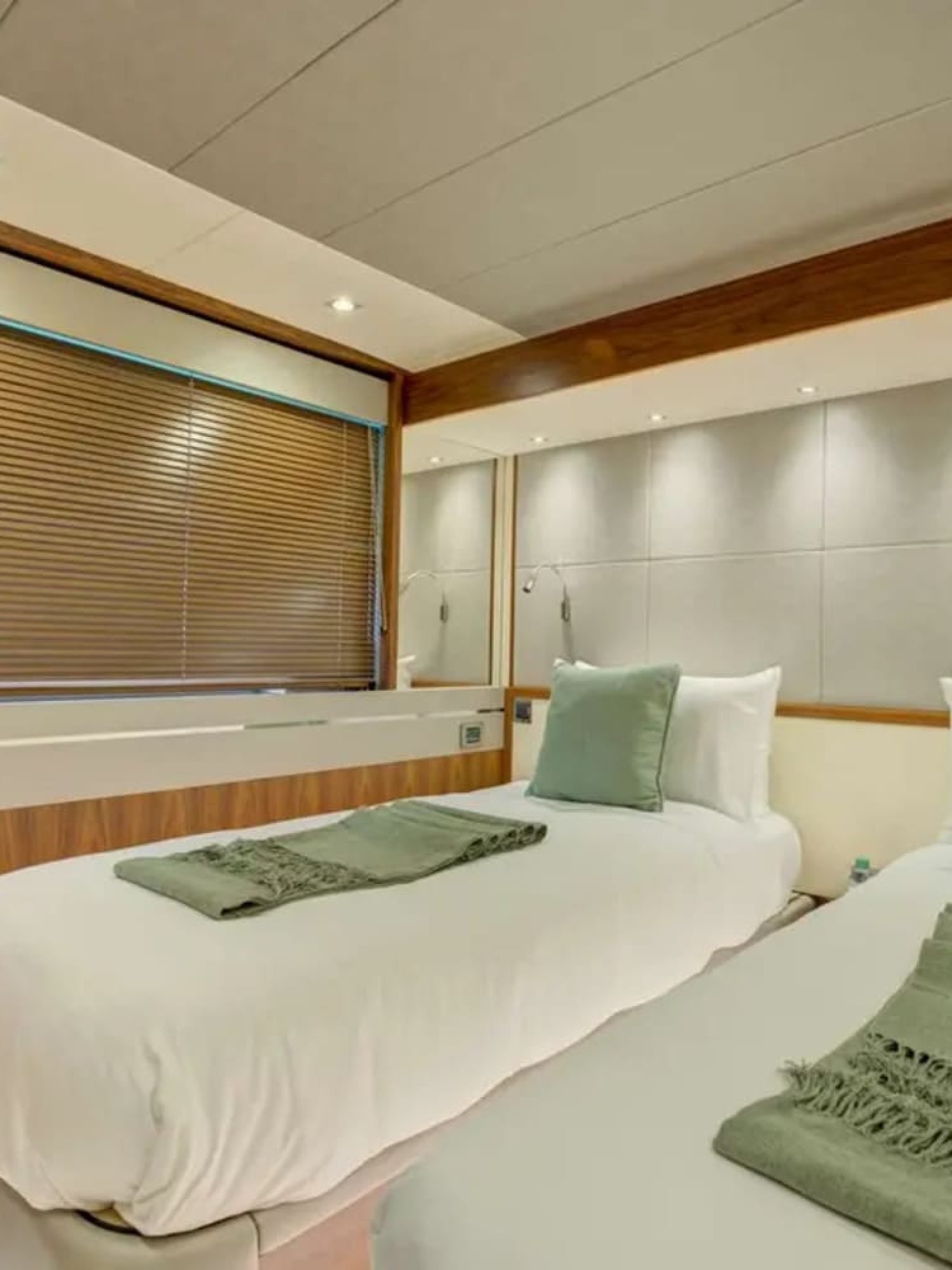 Cozy double bed stateroom featuring stylish decor and comfort aboard the yacht