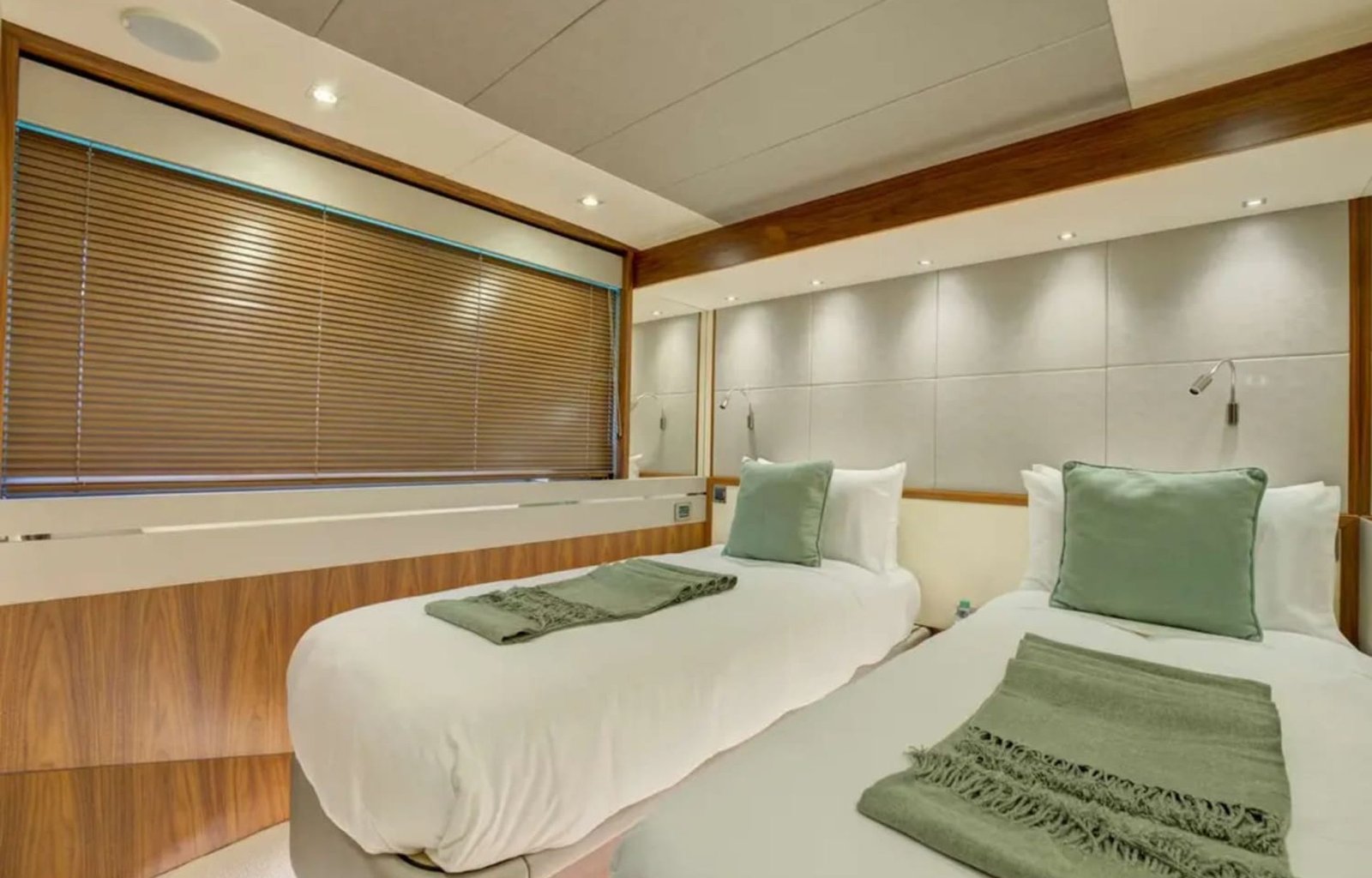 Cozy double bed stateroom featuring stylish decor and comfort aboard the yacht
