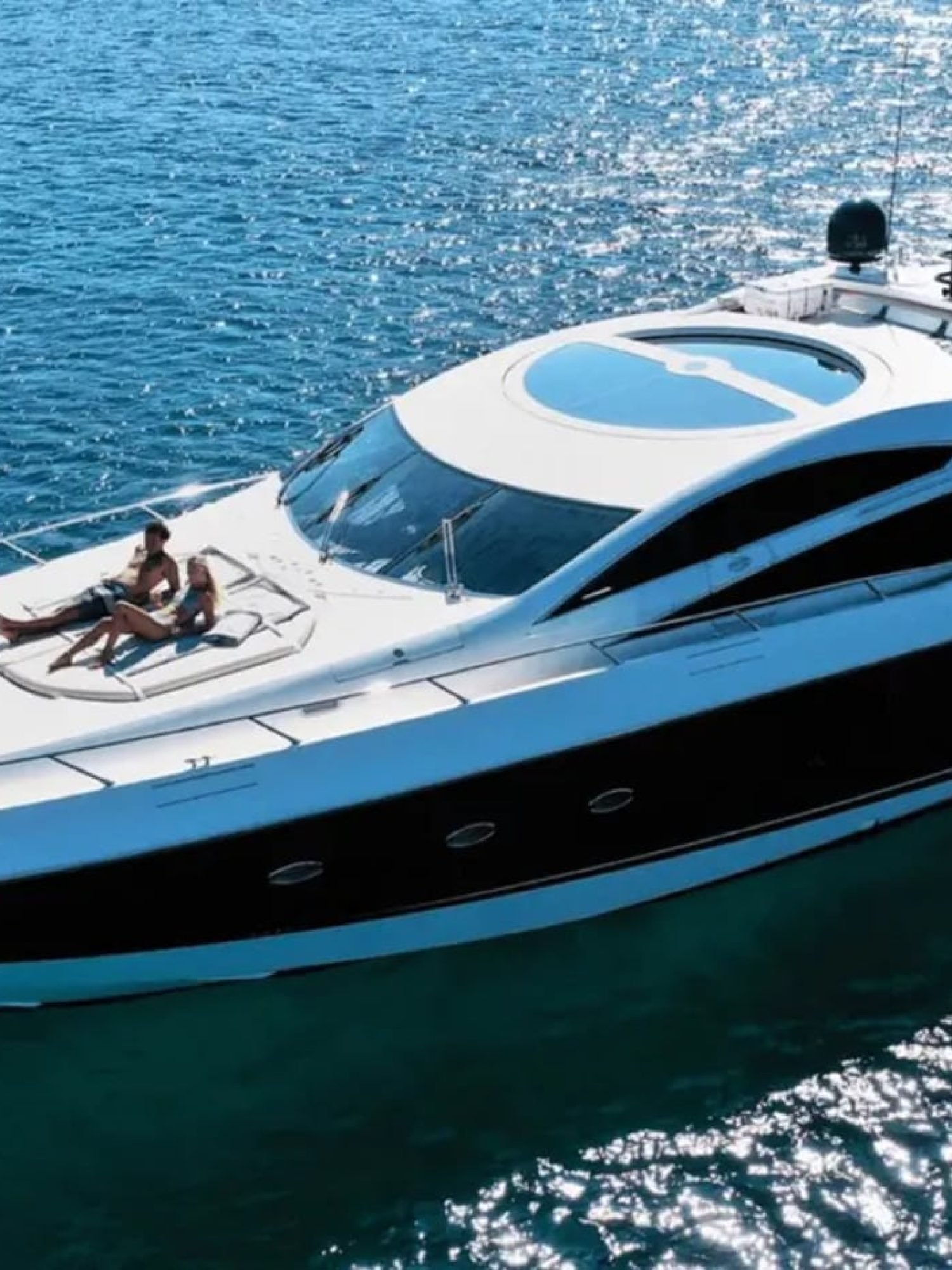 Aerial shot of the 82' Sunseeker luxury yacht cruising on the water.