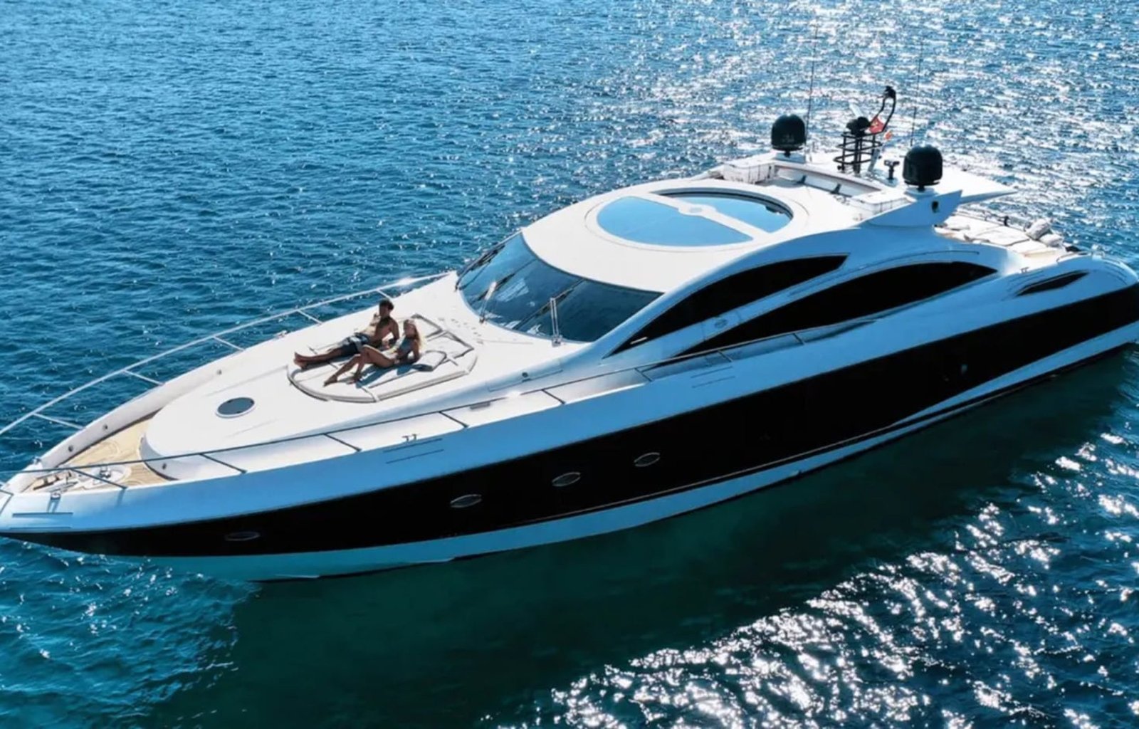 Aerial shot of the 82' Sunseeker luxury yacht cruising on the water.
