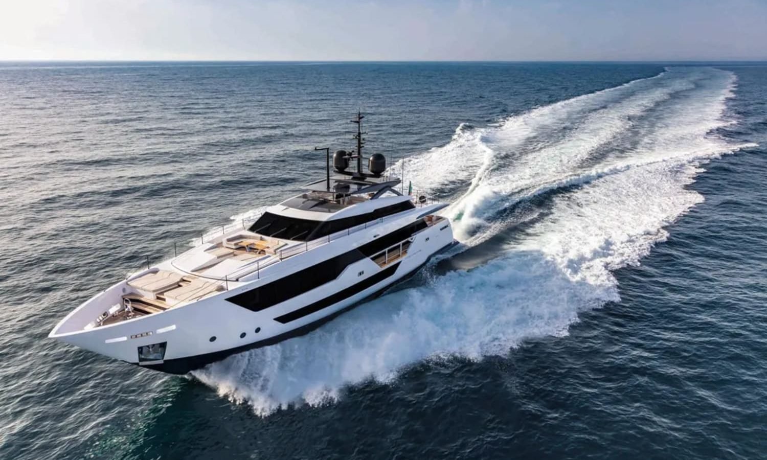 Side view of the 106' CUSTOM LINE yacht from another angle, emphasizing its elegance.