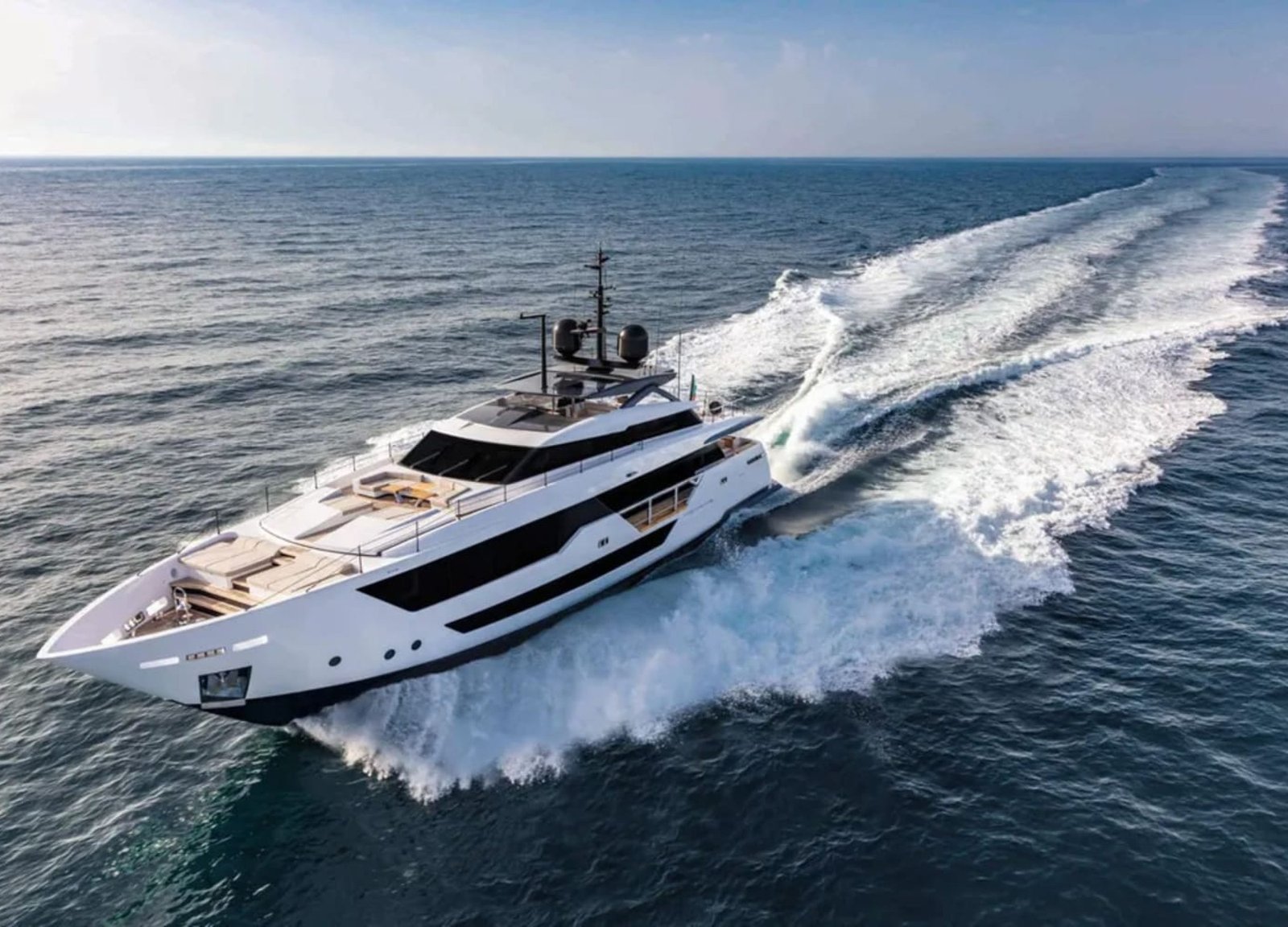 Side view of the 106' CUSTOM LINE yacht from another angle, emphasizing its elegance.