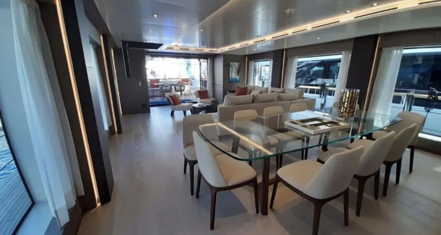 Dining area inside the 106' CUSTOM LINE yacht, designed for sophisticated meals.