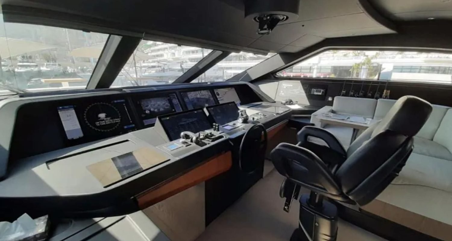 Helm station inside the 106' CUSTOM LINE yacht with state-of-the-art controls.