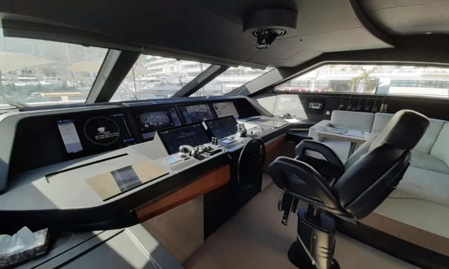 Helm station inside the 106' CUSTOM LINE yacht with state-of-the-art controls.