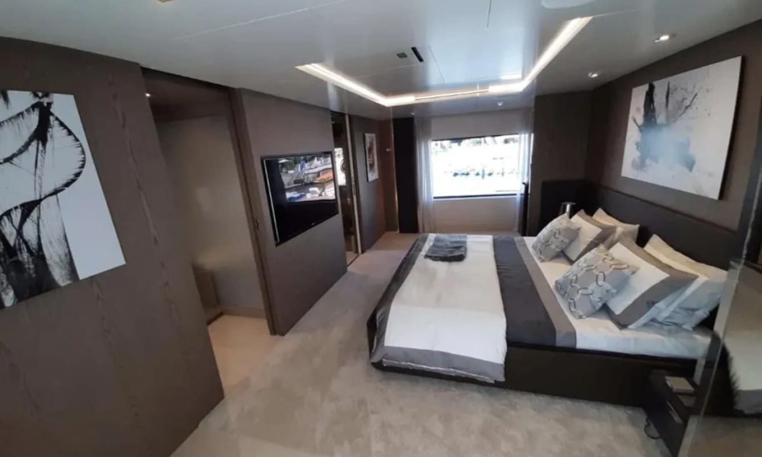 Another view of the master bedroom in the 106' CUSTOM LINE yacht with luxurious design.