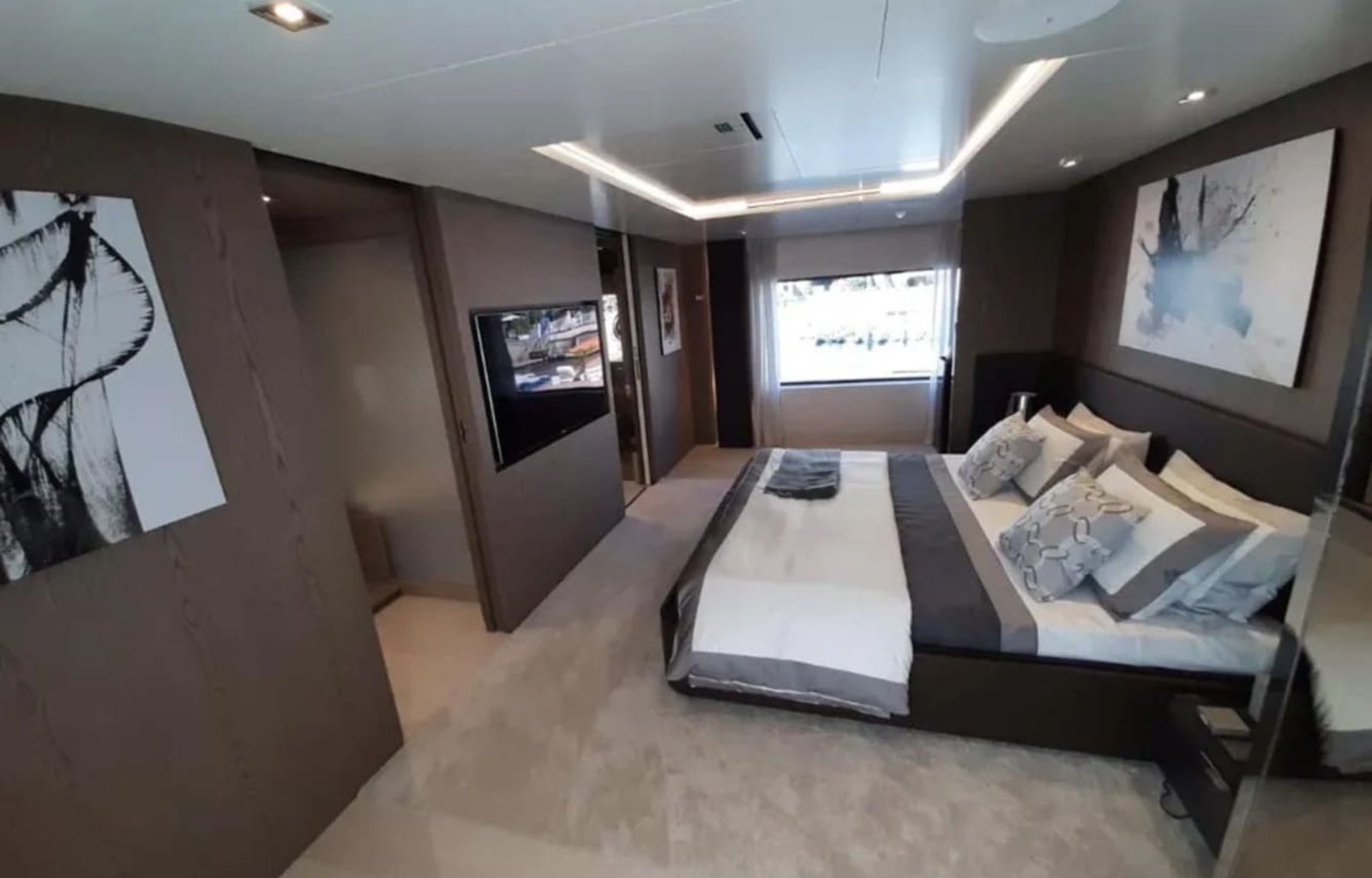 Another view of the master bedroom in the 106' CUSTOM LINE yacht with luxurious design.