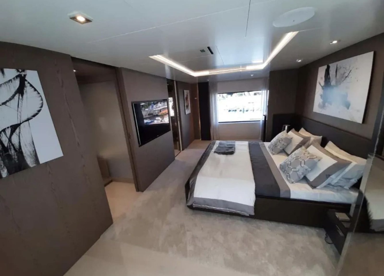 Another view of the master bedroom in the 106' CUSTOM LINE yacht with luxurious design.