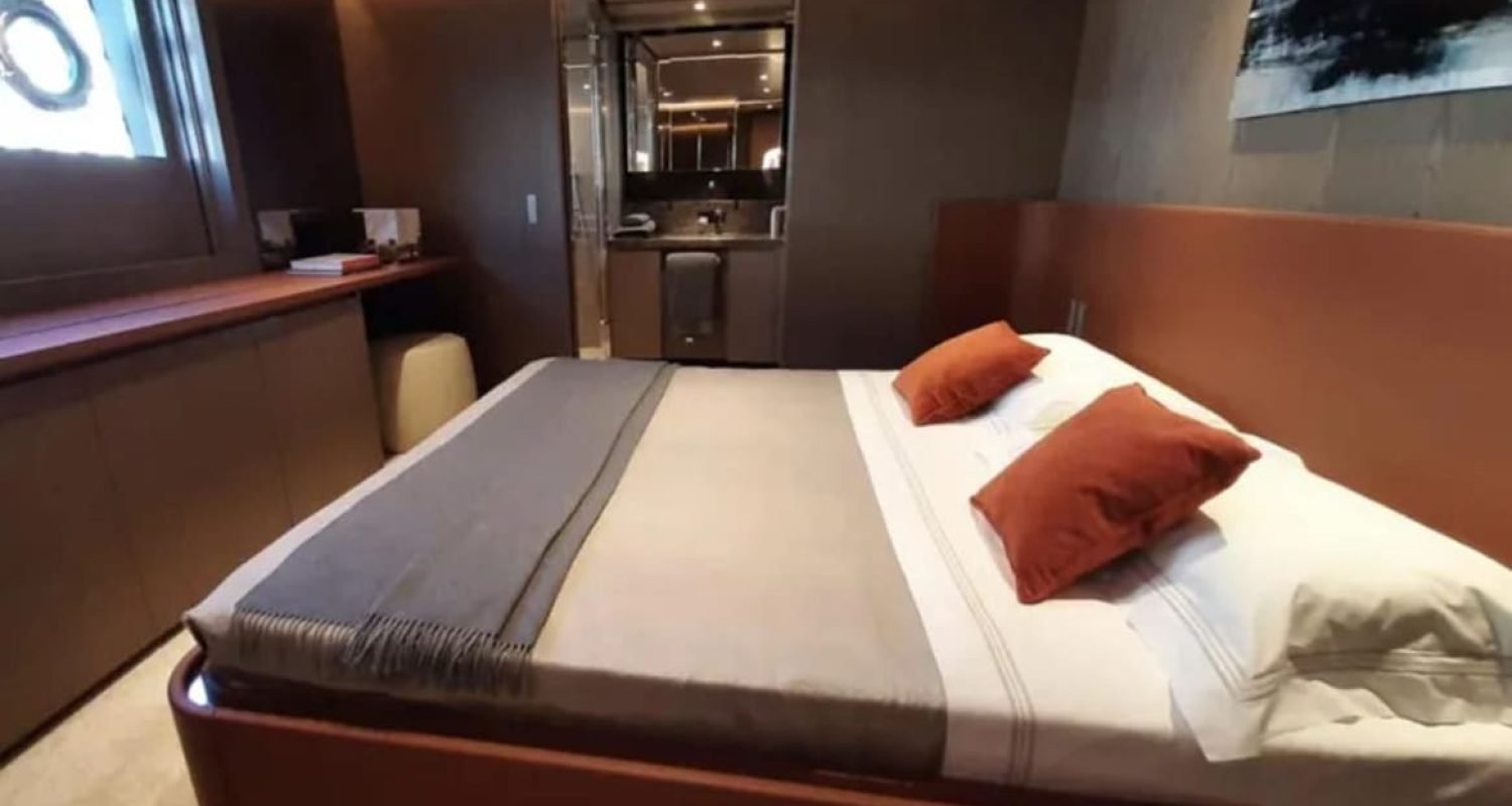 Guest bedroom on the 106' CUSTOM LINE yacht with elegant furnishings.