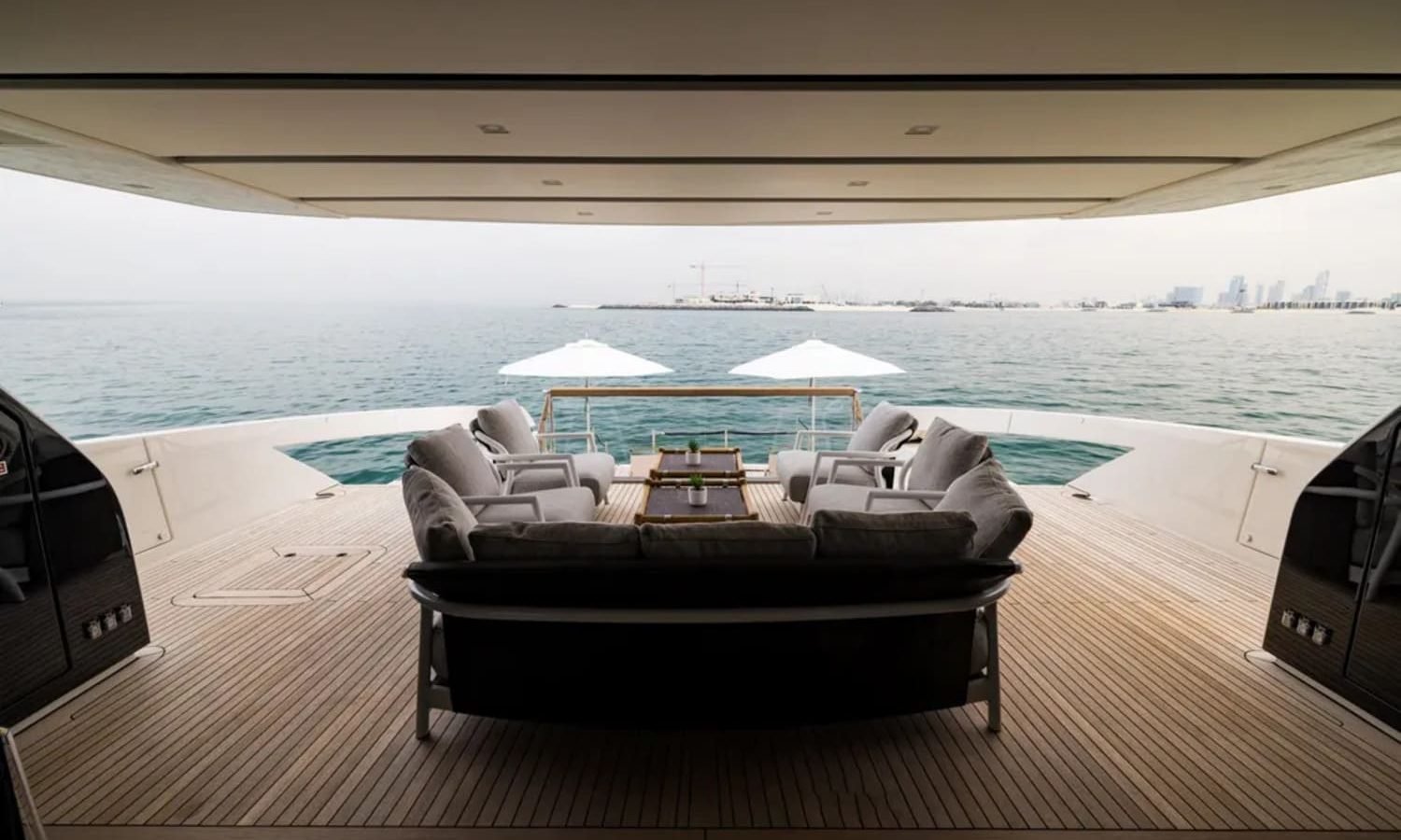 Elegant al fresco dining area on the 88' Sanlorenzo yacht’s deck.