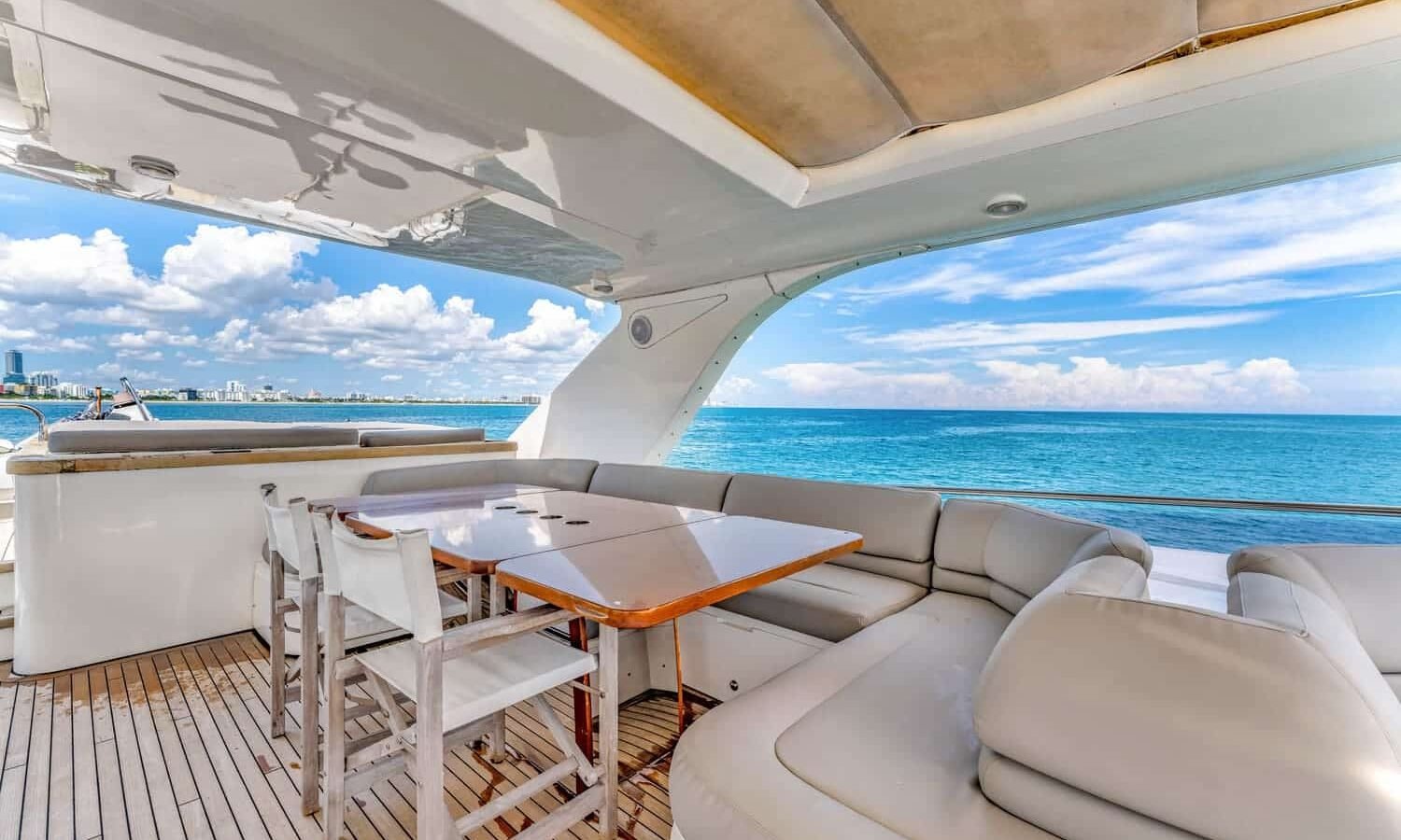 Another angle of the elegant outdoor lounge on the 88' PRINCESS yacht, designed for comfort and entertainment.