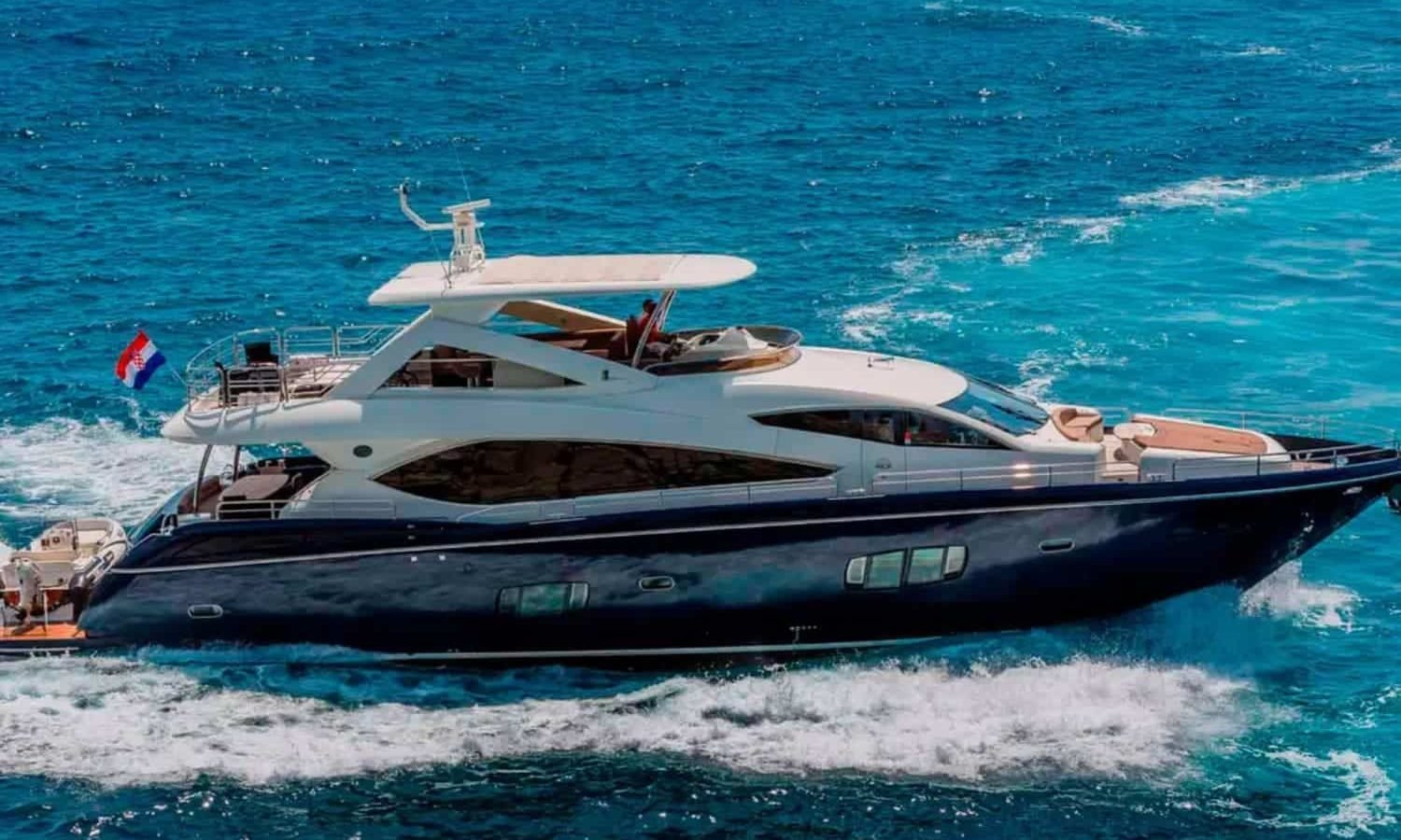 Croatia 7 Side perspective of the yacht, highlighting its modern lines and spacious decks.