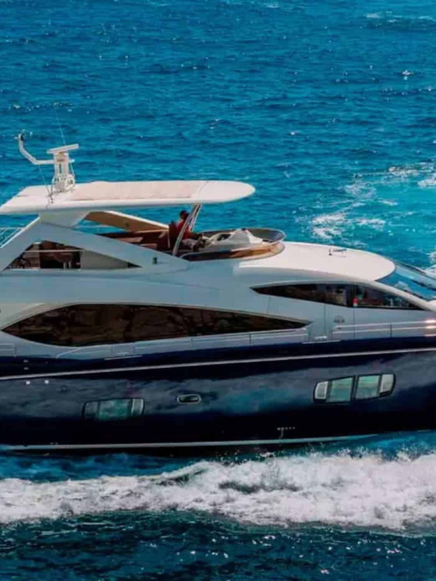 Side perspective of the yacht, highlighting its modern lines and spacious decks.