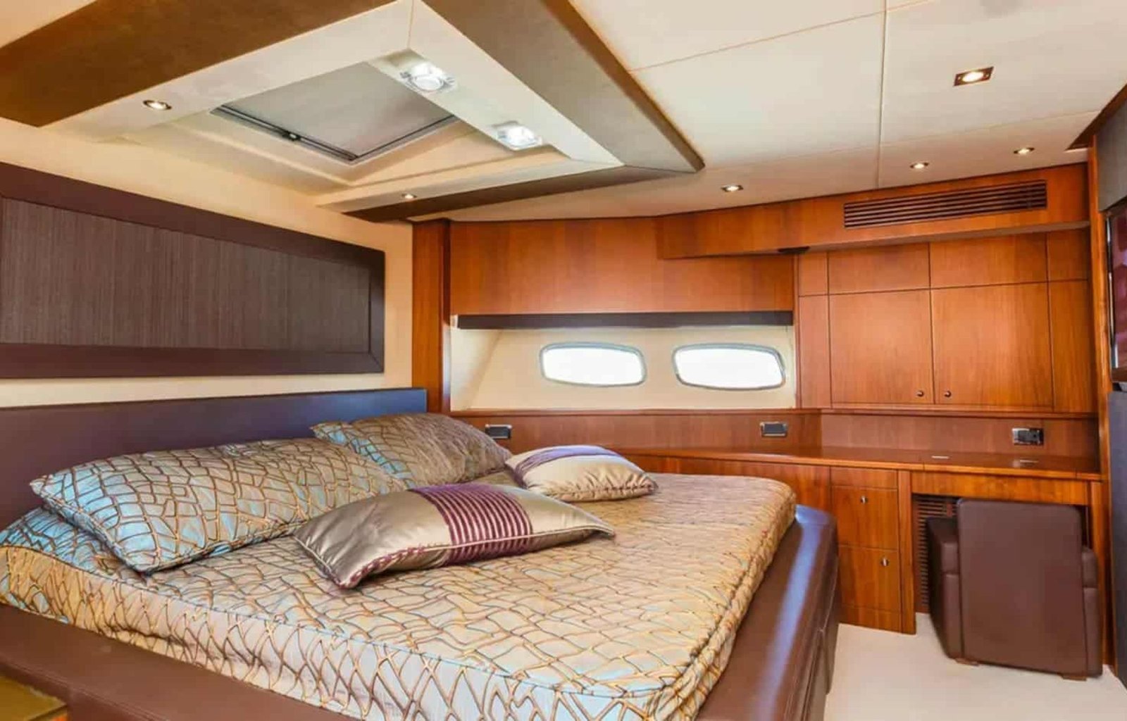 The VIP stateroom aboard the 88' Sunseeker yacht, offering premium comfort and sophisticated style.