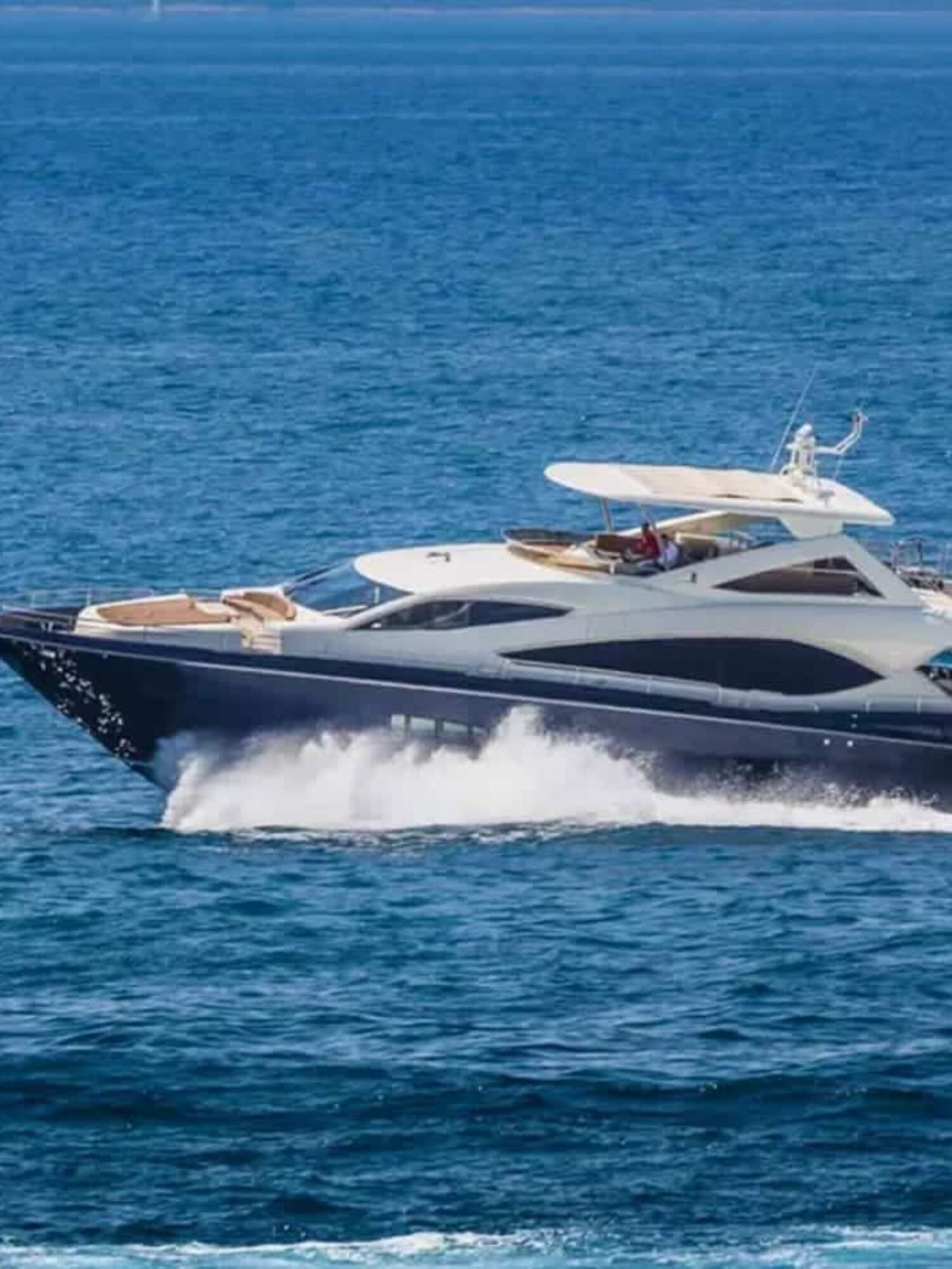 Side perspective of the yacht, highlighting its modern lines and spacious decks.