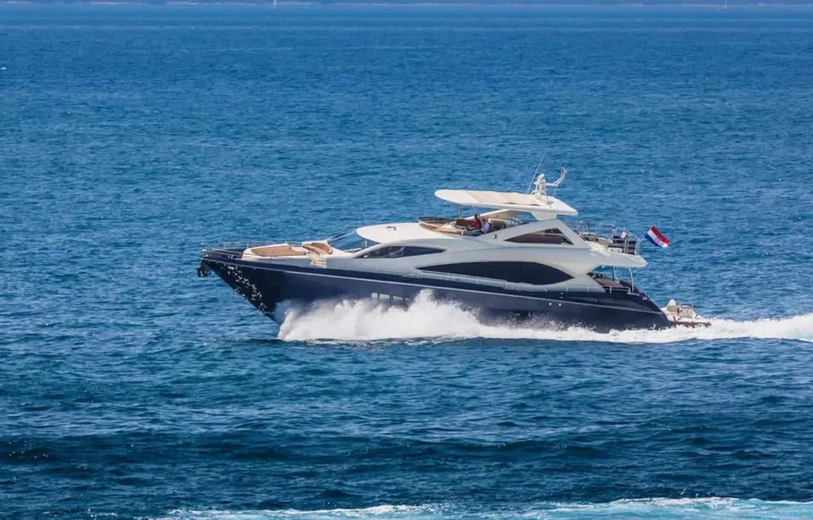 Side perspective of the yacht, highlighting its modern lines and spacious decks.