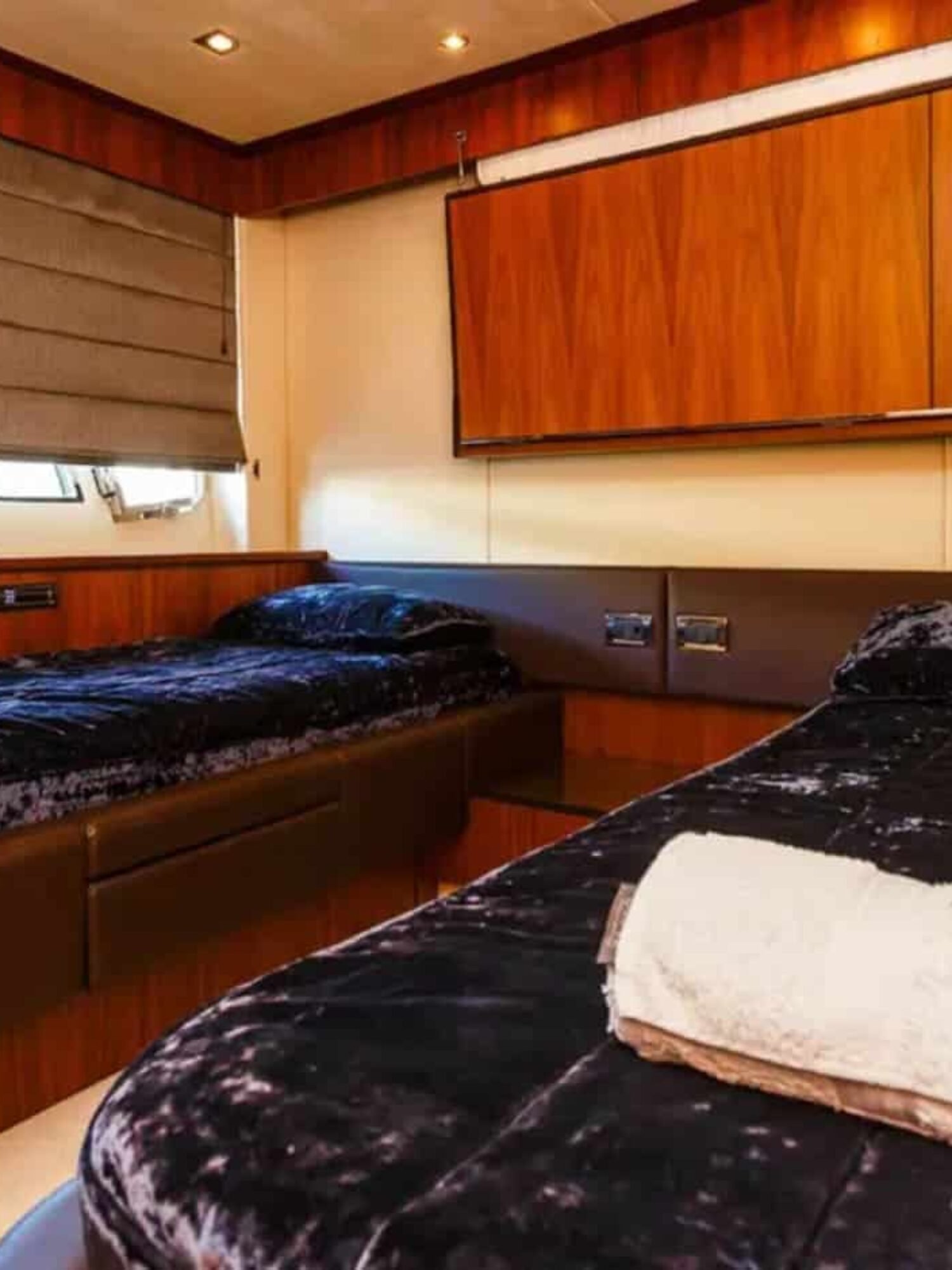 Twin guest stateroom on the 88' Sunseeker yacht, designed for comfort and relaxation.