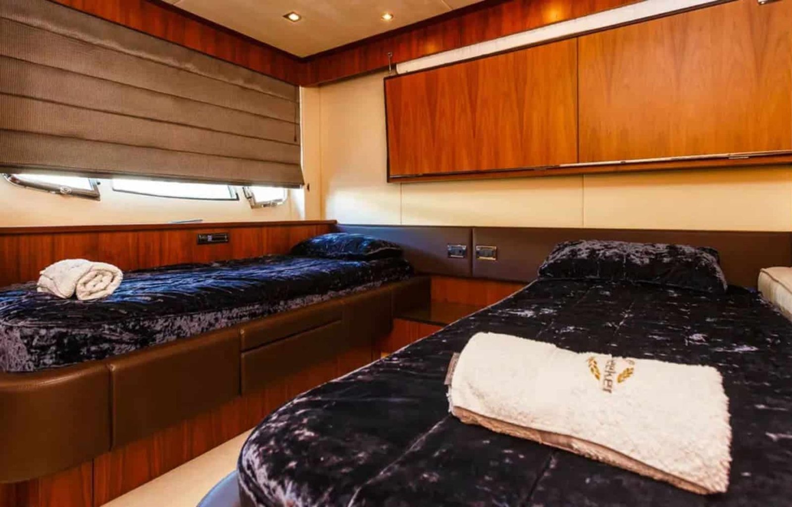 Twin guest stateroom on the 88' Sunseeker yacht, designed for comfort and relaxation.