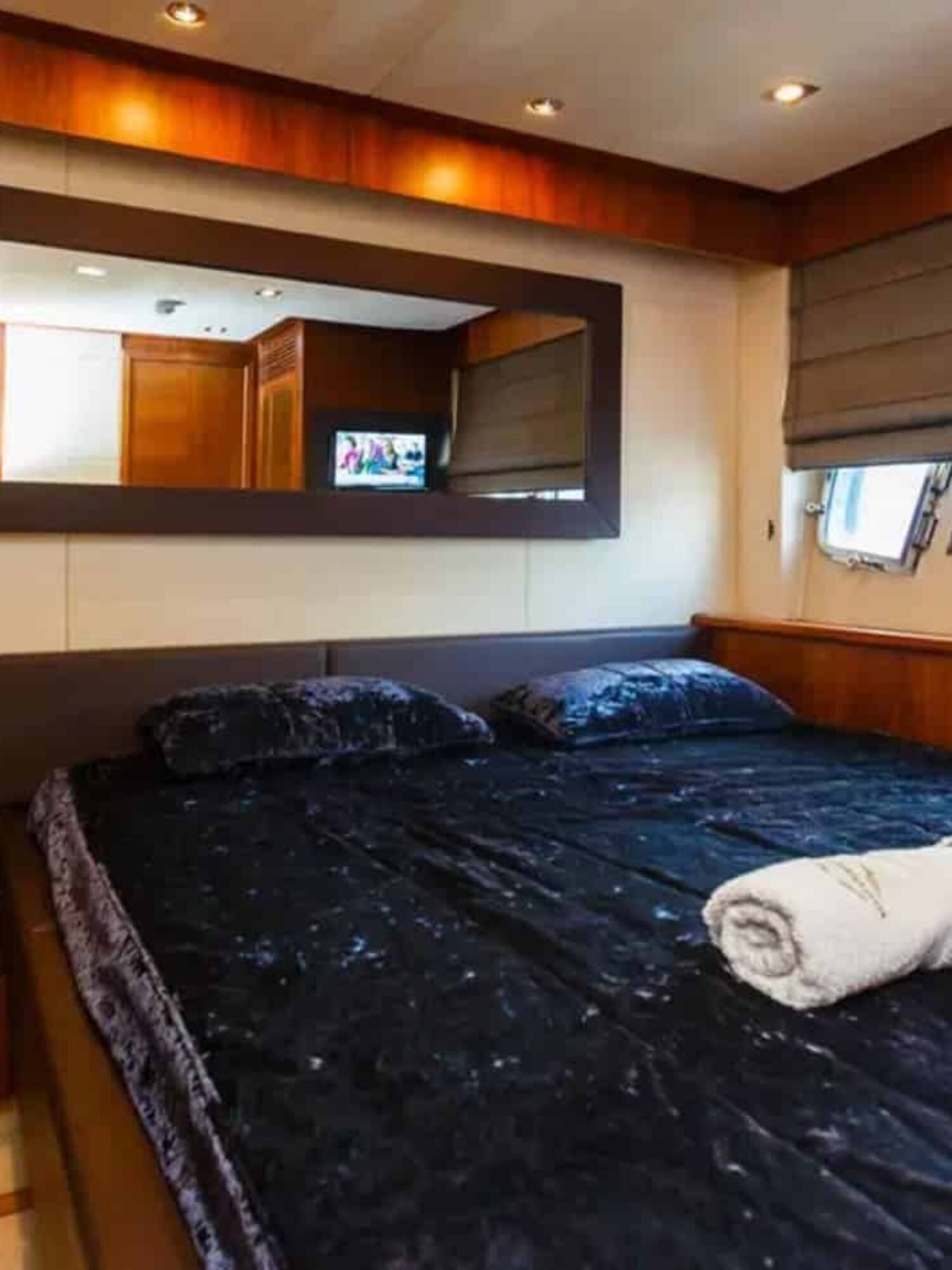 The luxurious master stateroom of the 88' Sunseeker yacht, featuring a king-size bed and elegant décor.
