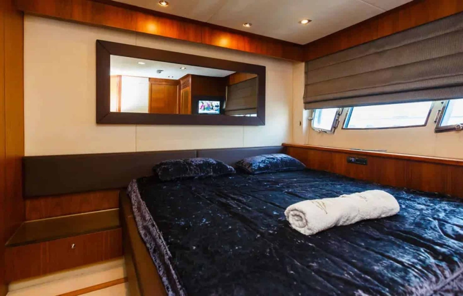 The luxurious master stateroom of the 88' Sunseeker yacht, featuring a king-size bed and elegant décor.