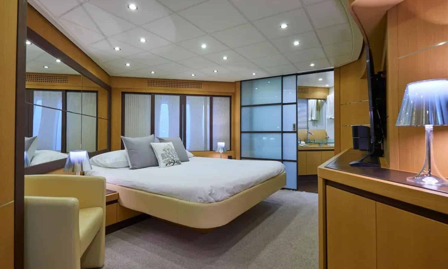 Ibiza 6 Luxurious master stateroom aboard the yacht, featuring elegant furnishings and an en-suite bathroom.
