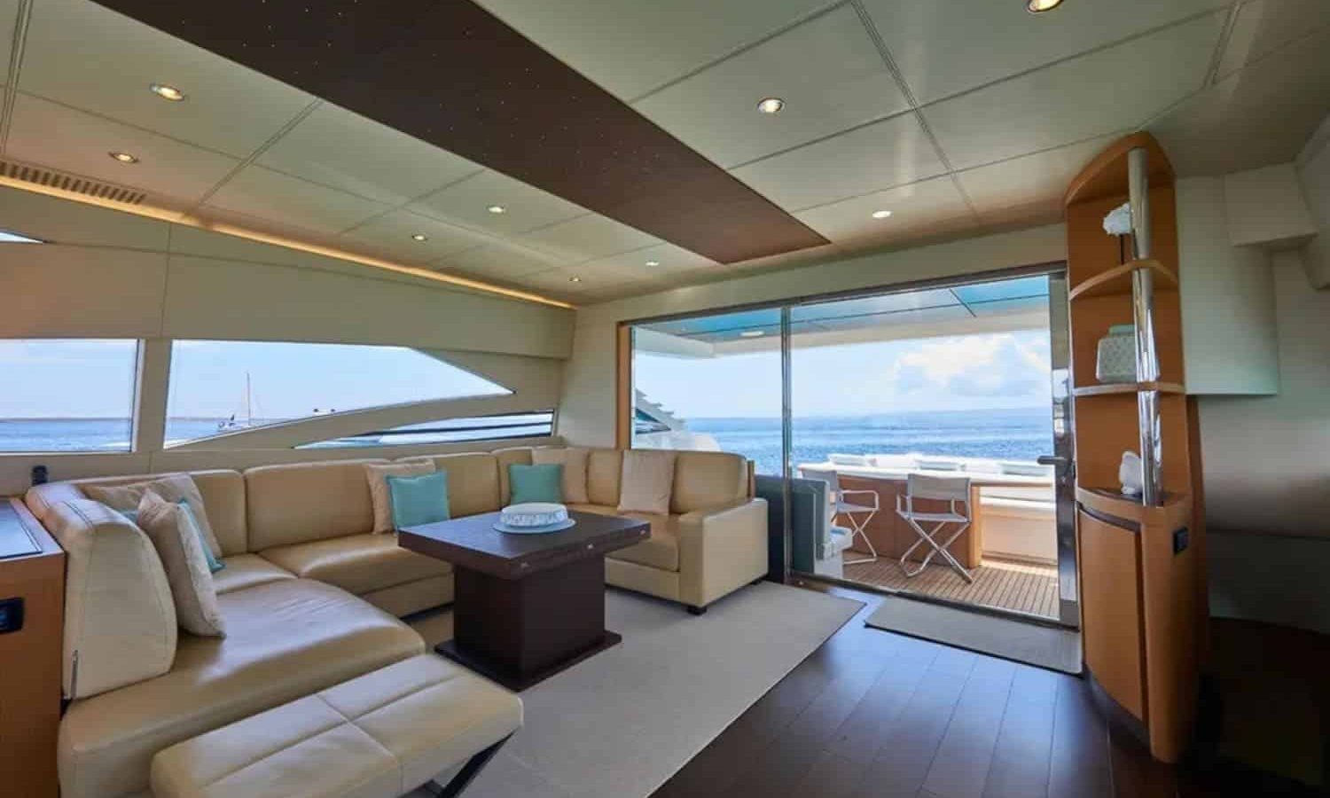 Ibiza 5 Spacious and luxurious salon interior of the 90' Pershing yacht with panoramic windows offering breathtaking views.