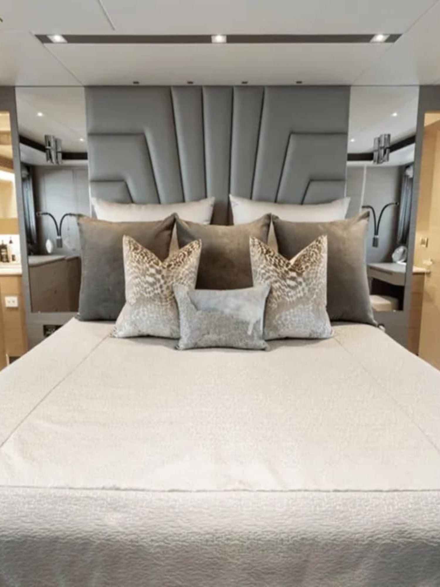 Luxurious large bed in a stateroom of the 90' HORIZON yacht