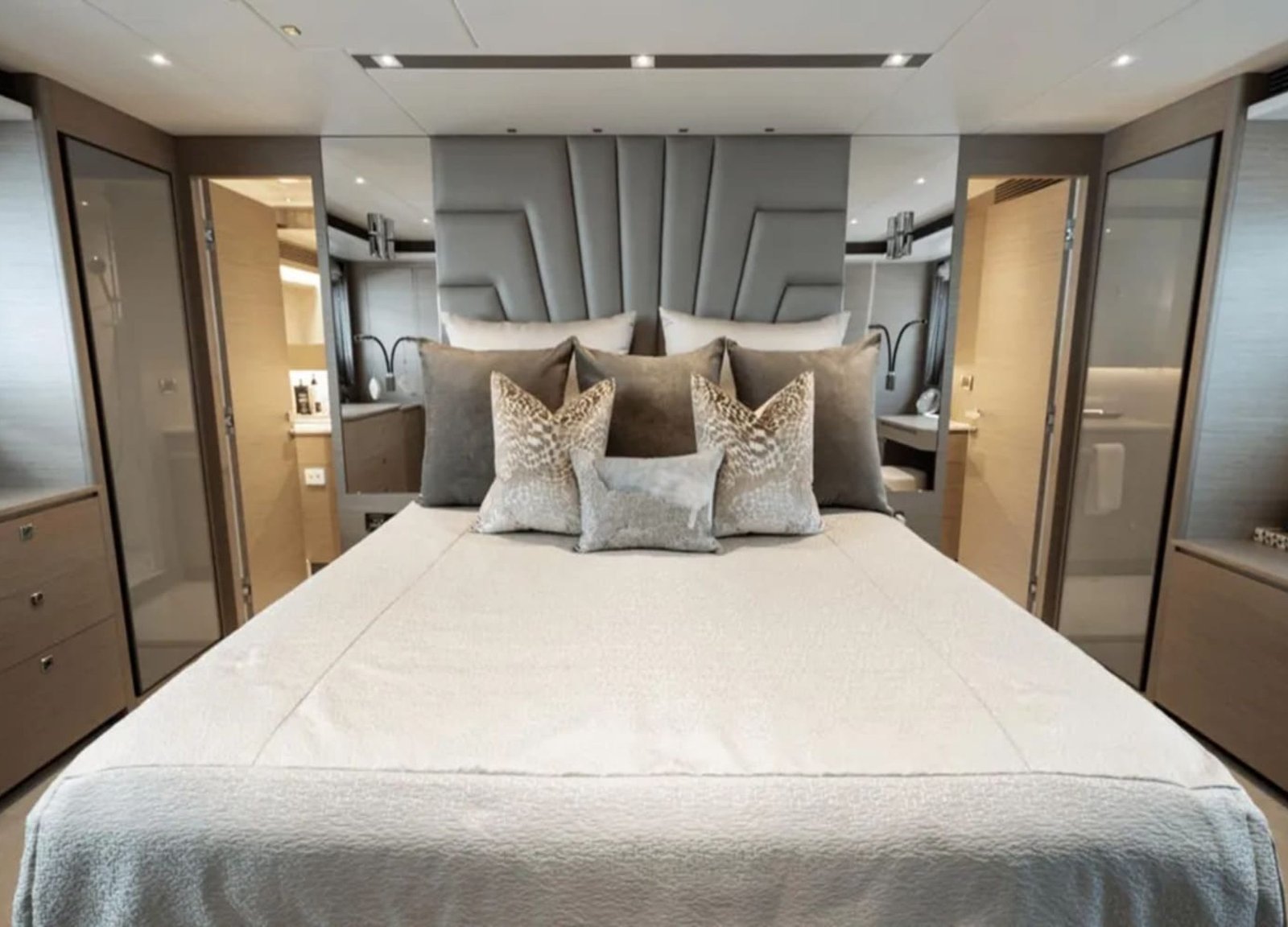 Luxurious large bed in a stateroom of the 90' HORIZON yacht