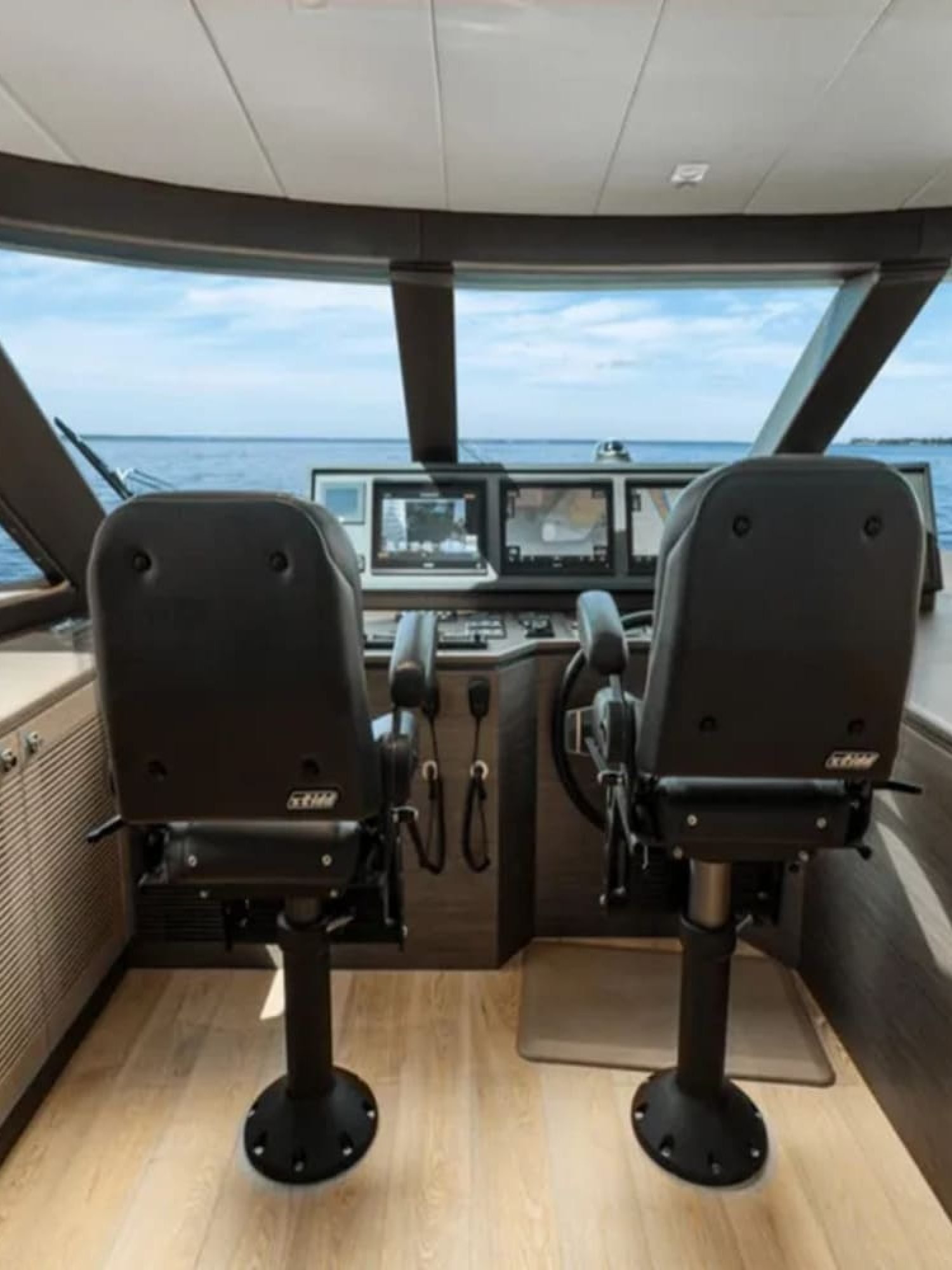 Detailed view of the control panel at the helm of the 90' HORIZON yacht