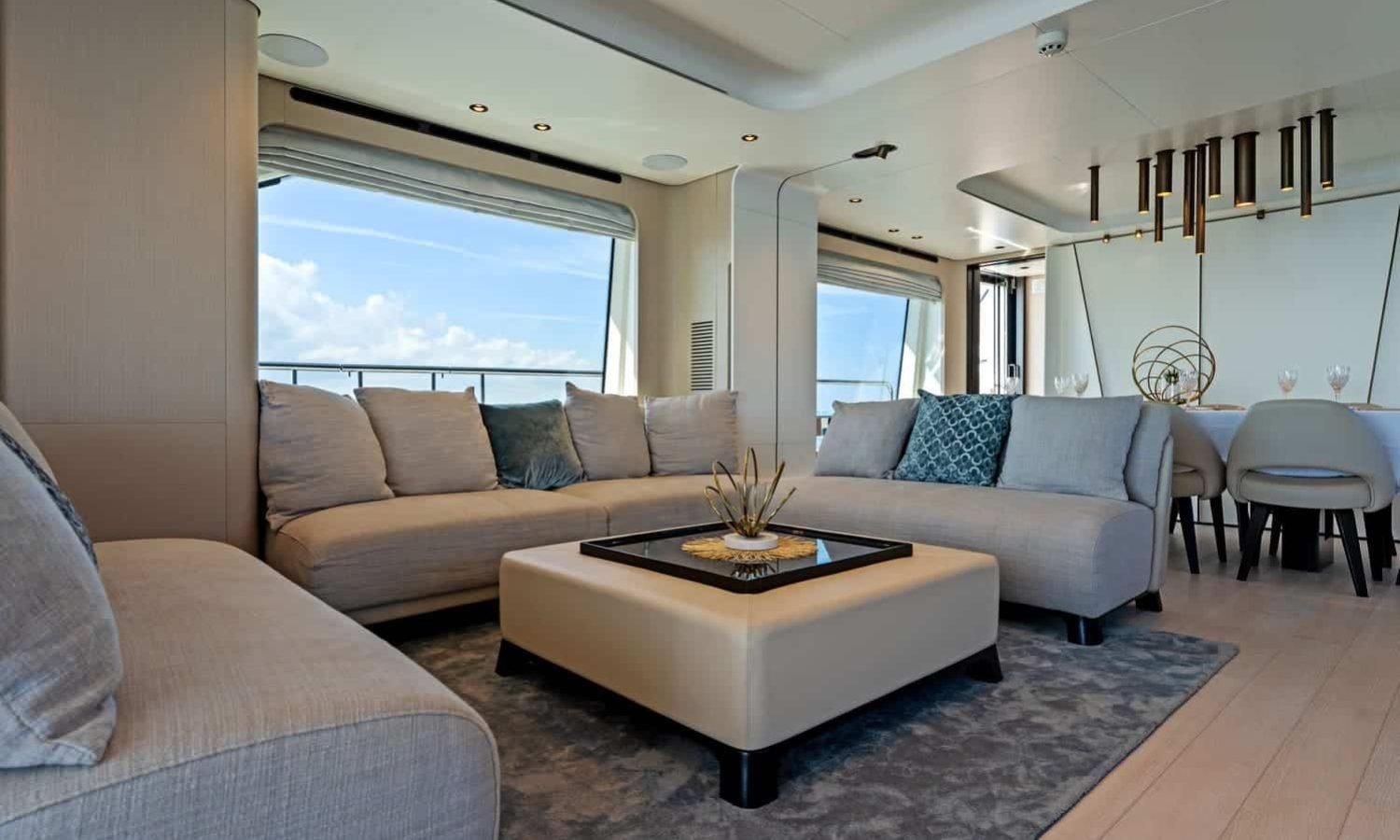 The stylish living room of the 88' AZIMUT, featuring sophisticated design and comfort for relaxation