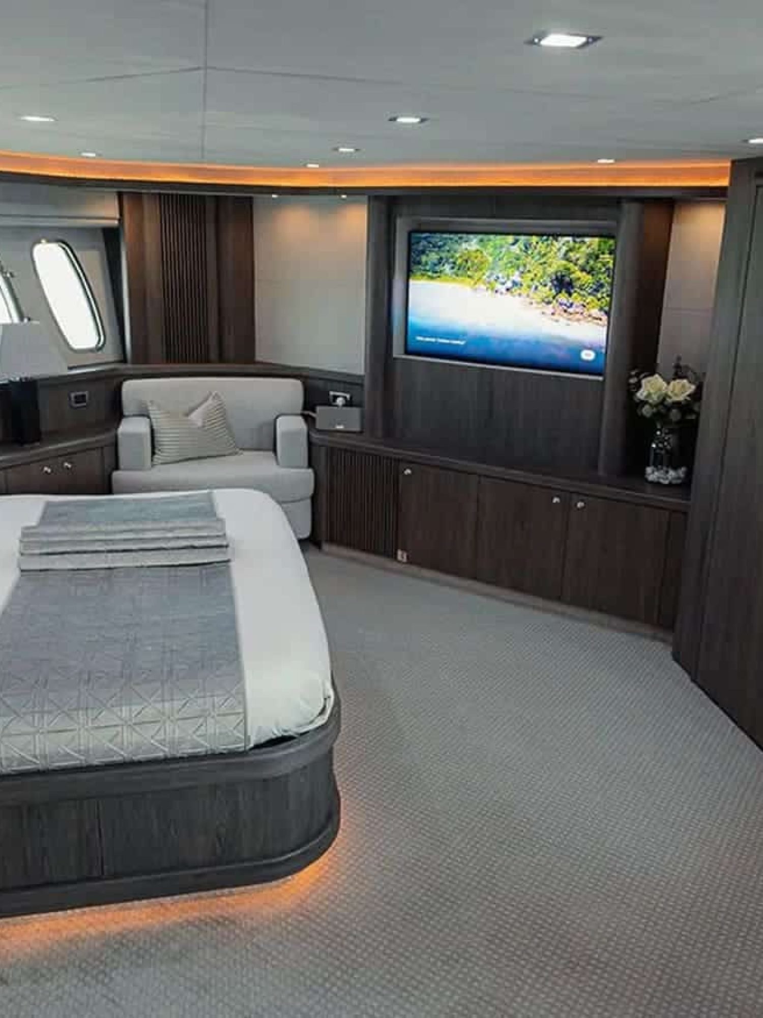 Luxurious master suite with a king-size bed and elegant decor.