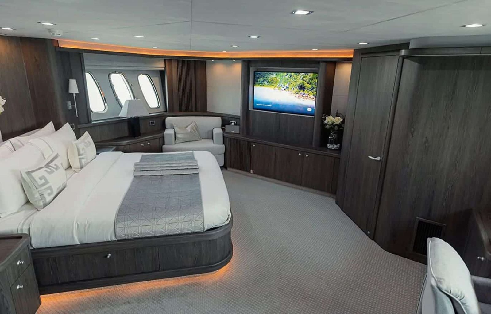 Luxurious master suite with a king-size bed and elegant decor.