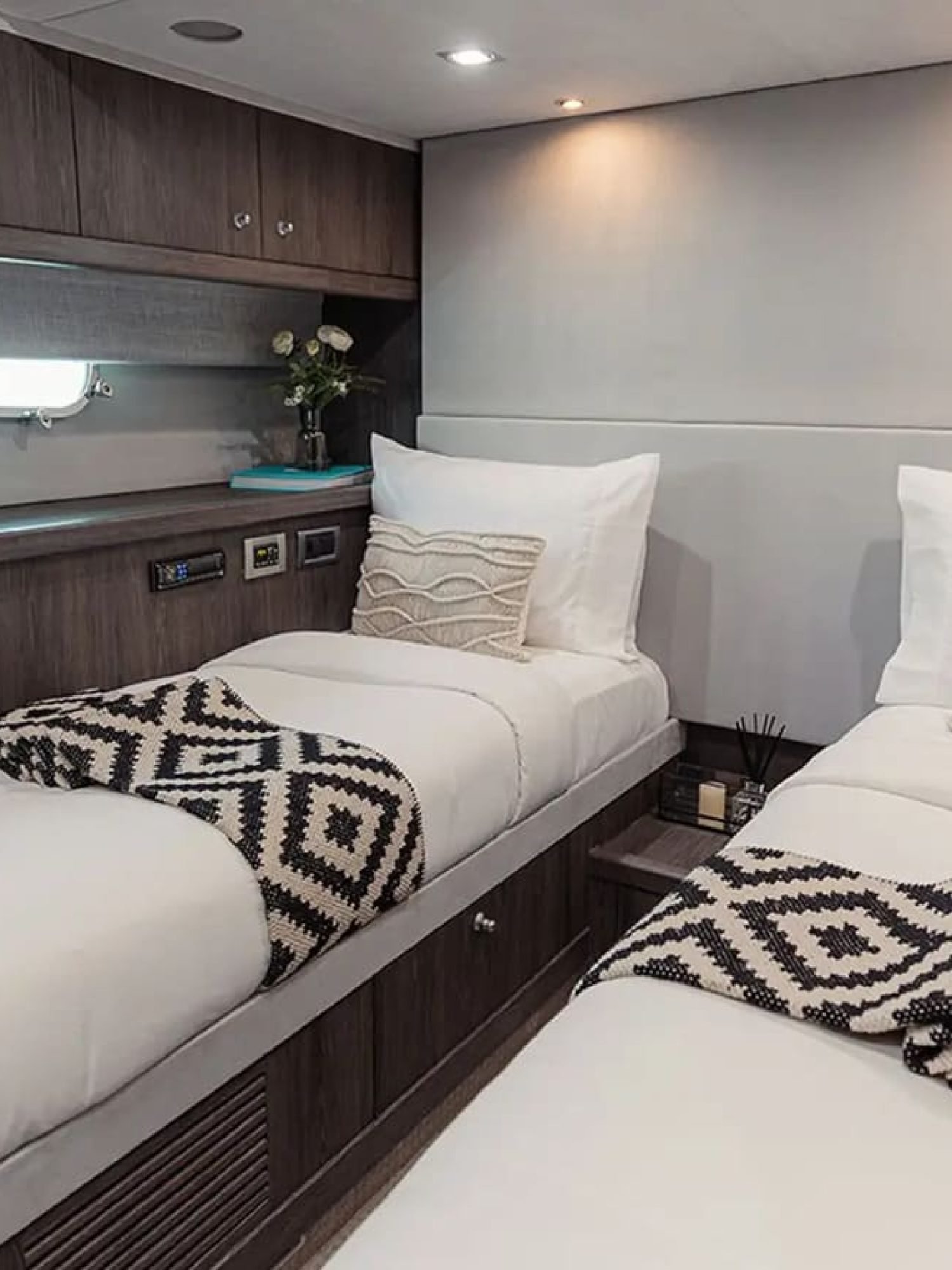 Guest cabin featuring two single beds and a modern design.