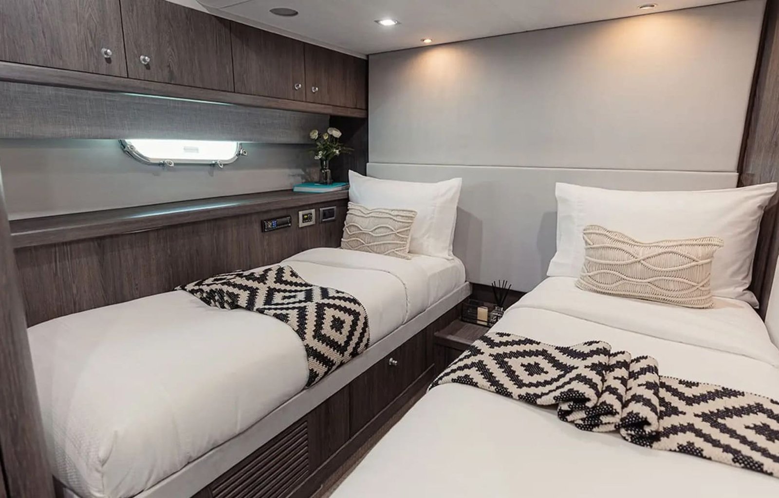 Guest cabin featuring two single beds and a modern design.