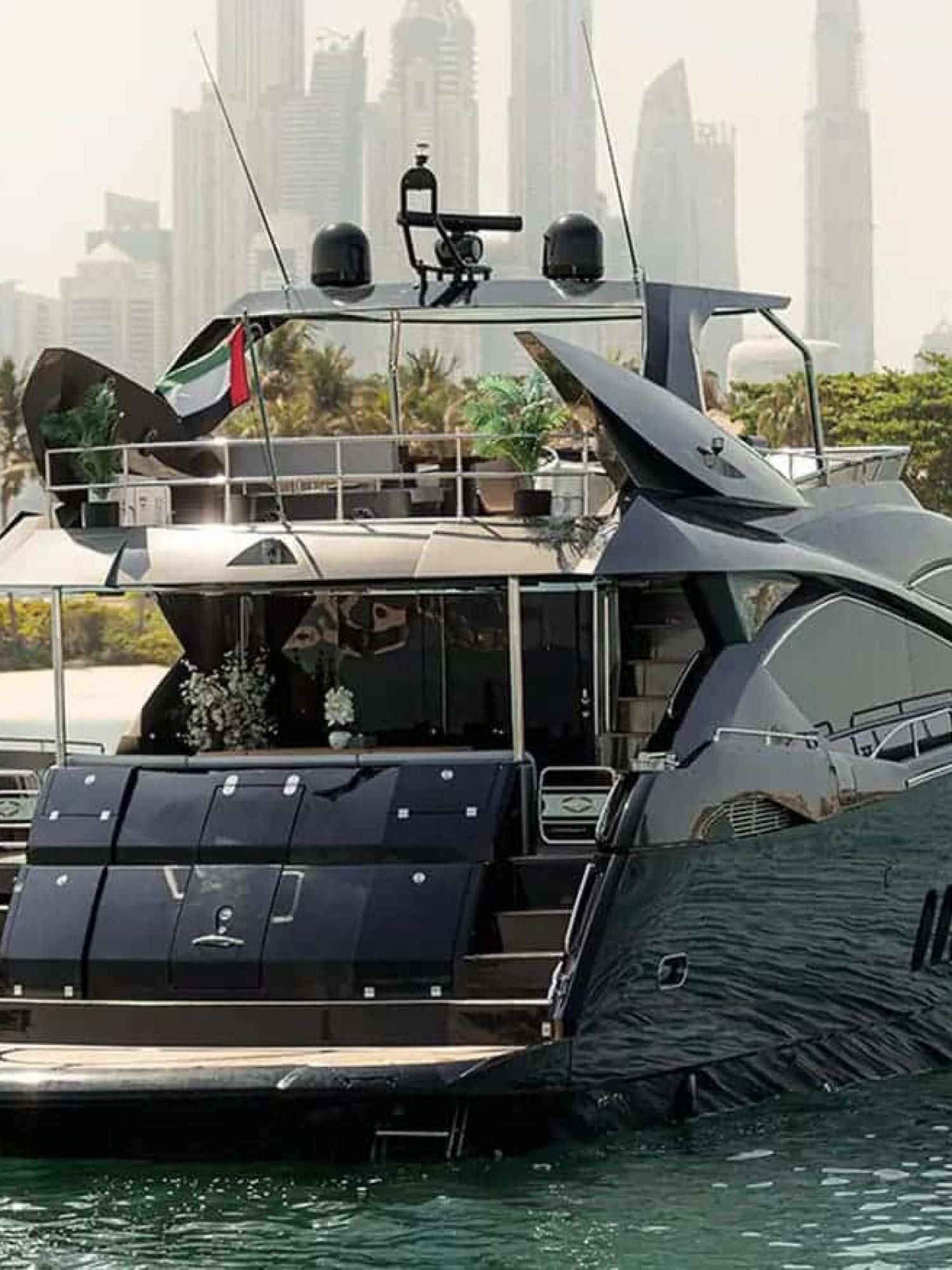 Rear view of the 82' Sunseeker yacht, highlighting its spacious aft deck and luxurious outdoor seating.