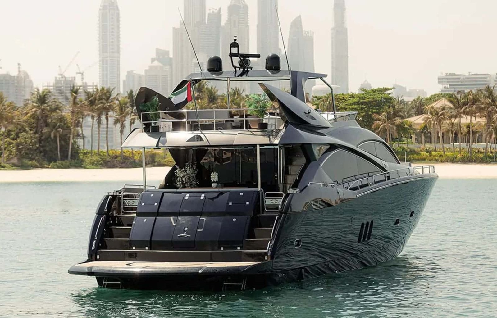 Rear view of the 82' Sunseeker yacht, highlighting its spacious aft deck and luxurious outdoor seating.