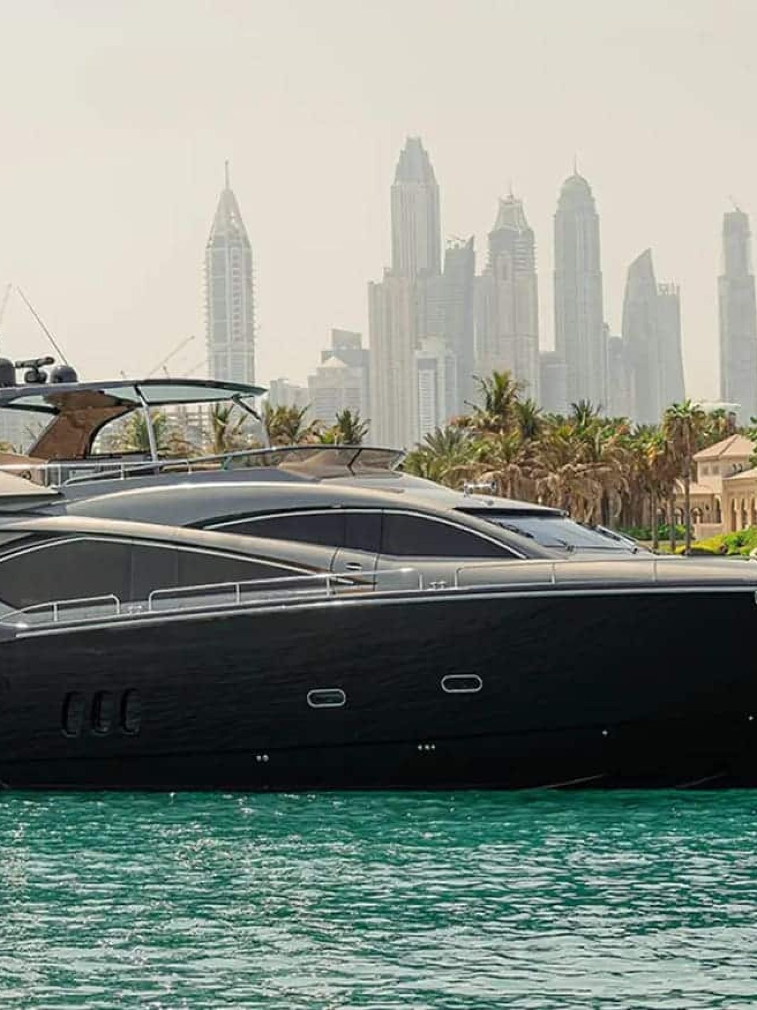 Side view of the 82' Sunseeker luxury yacht, showcasing its sleek and elegant design.