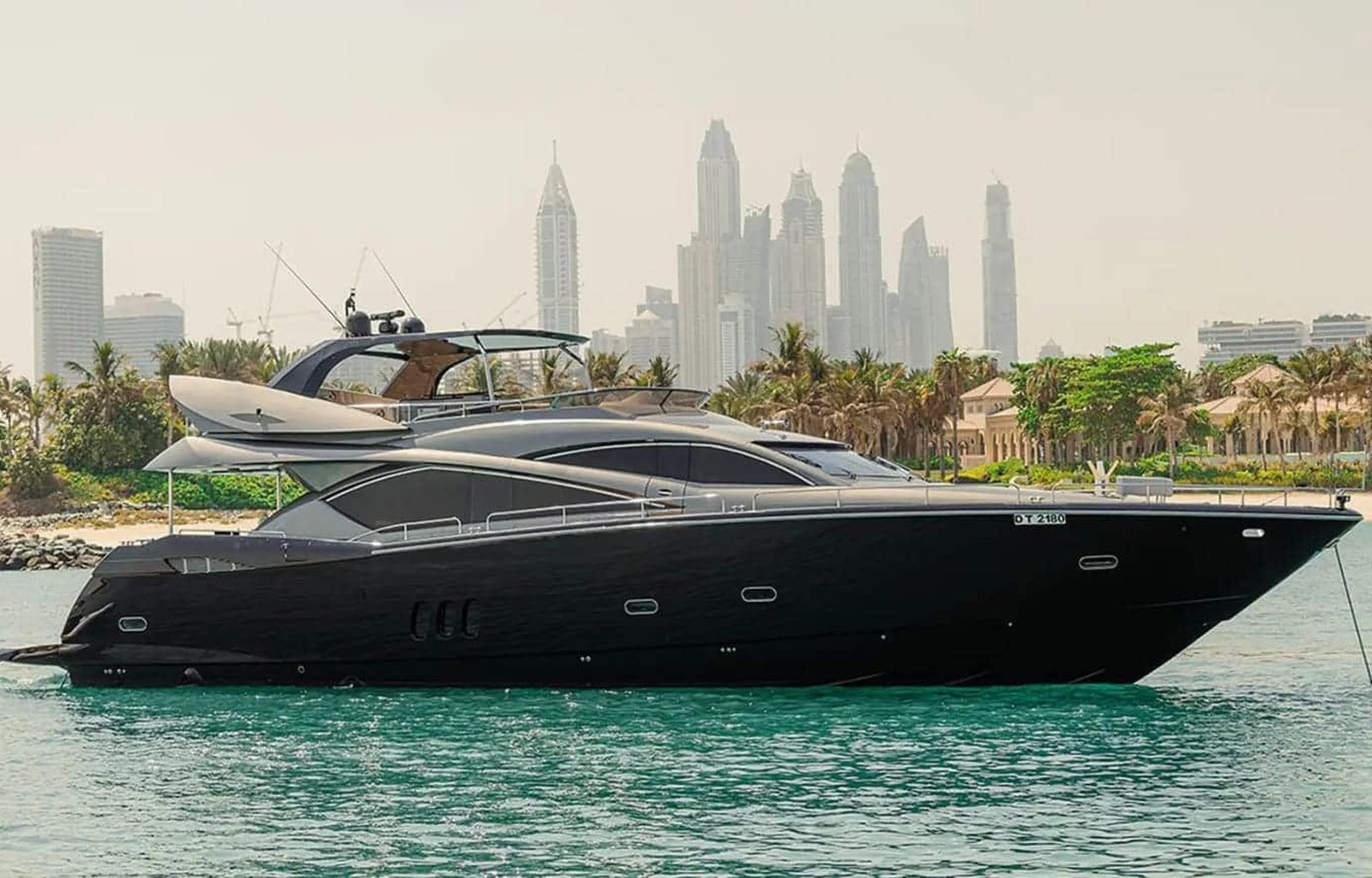 Side view of the 82' Sunseeker luxury yacht, showcasing its sleek and elegant design.
