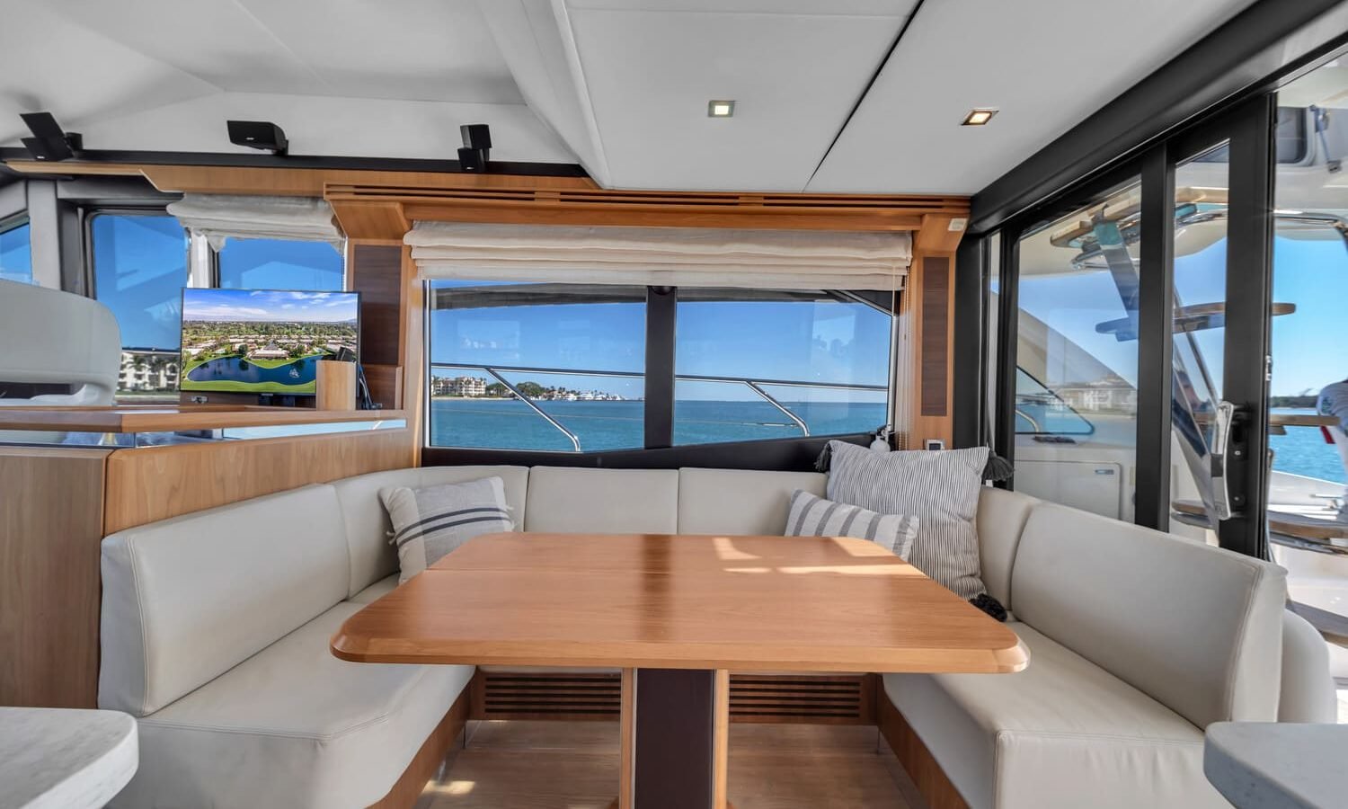 Dining area on the 60' ABSOLUTE FLY yacht, perfect for an elegant dining experience.