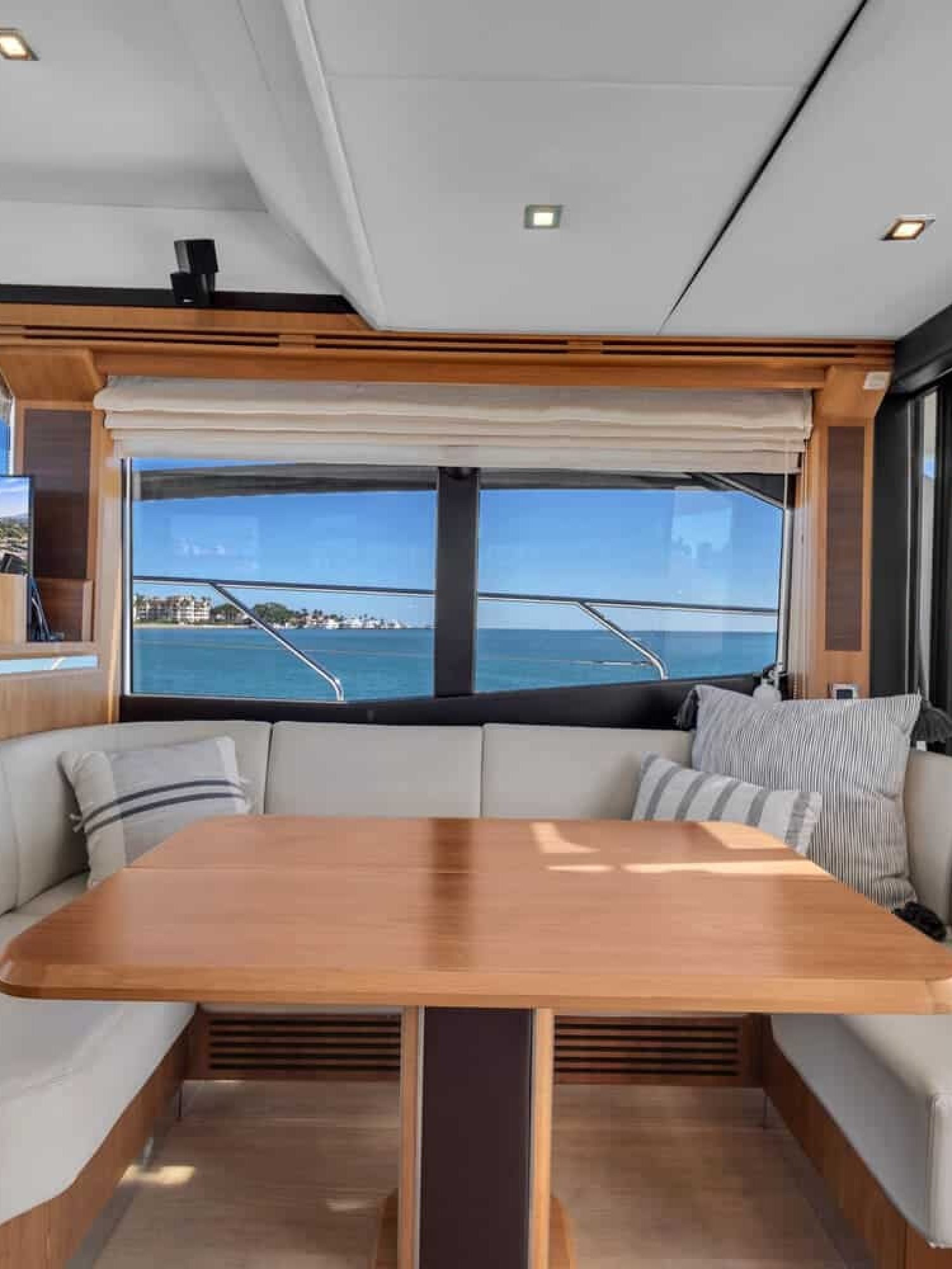 Dining area on the 60' ABSOLUTE FLY yacht, perfect for an elegant dining experience.