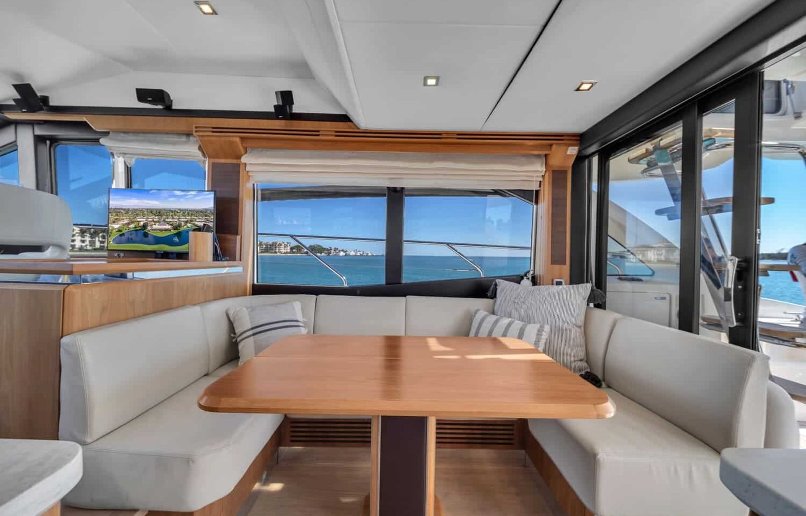 Dining area on the 60' ABSOLUTE FLY yacht, perfect for an elegant dining experience.